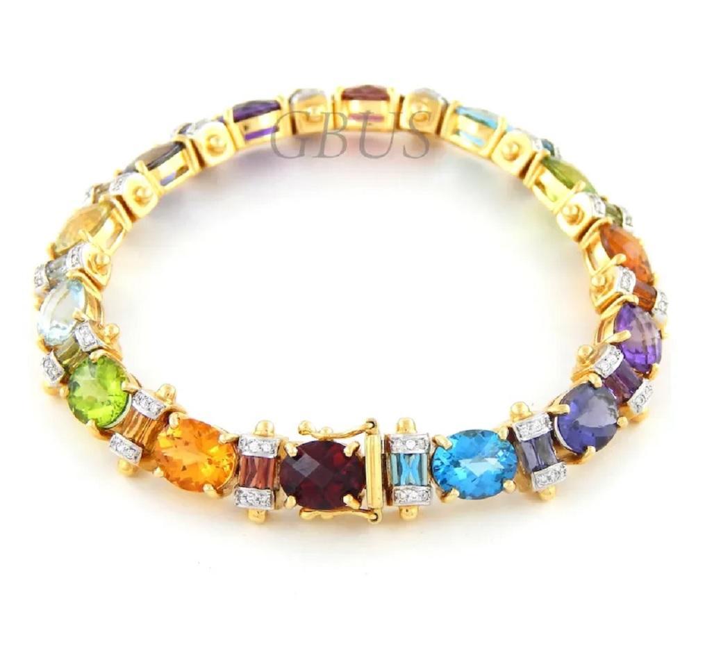 This is a new without tag custom made Sophisticated Multi Natural Oval Cut Gemstones Ladies Bracelet in 18K Yellow Gold. One of a kind model of bracelet. Offers a very elegant, tasteful and stylish look on a woman's hand. The gemstones (Garnet,