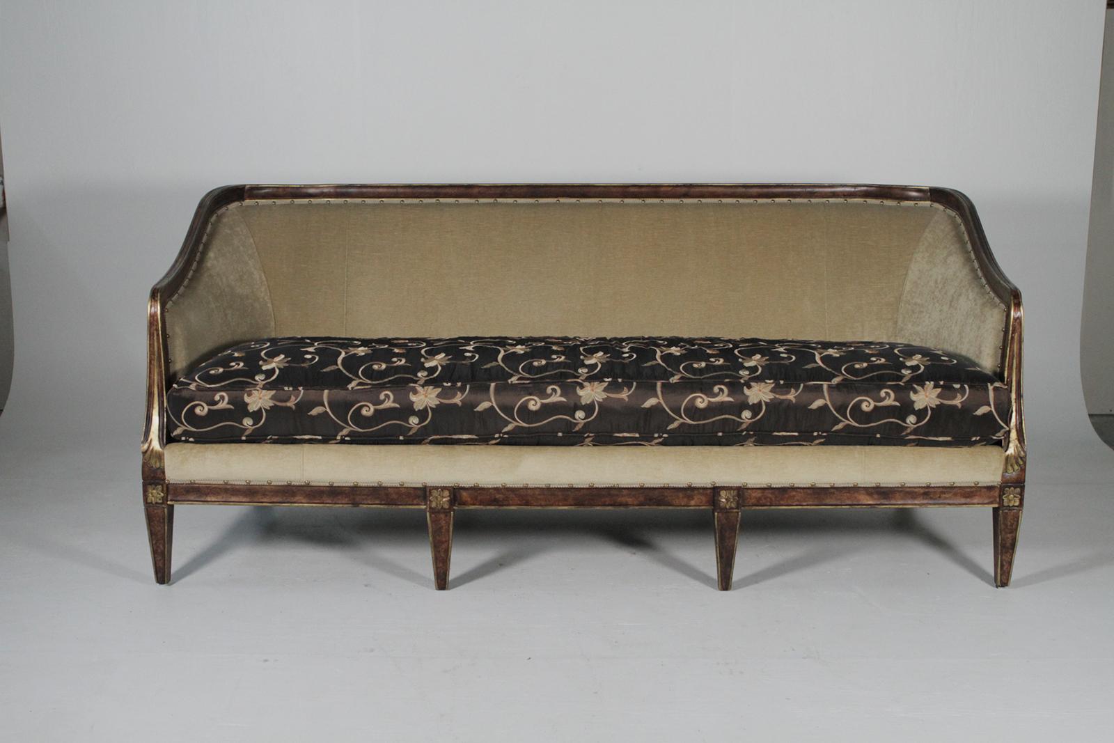 Walnut sofa with gilt details upholstered in a quality fawn velvet and chocolate embroidered silk. The curved attached back with contrasting loose cushion with nailhead trim around the edge.