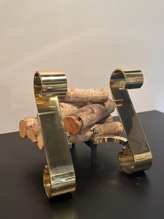 Sophisticated Pair of Moderne Polished Brass Andirons