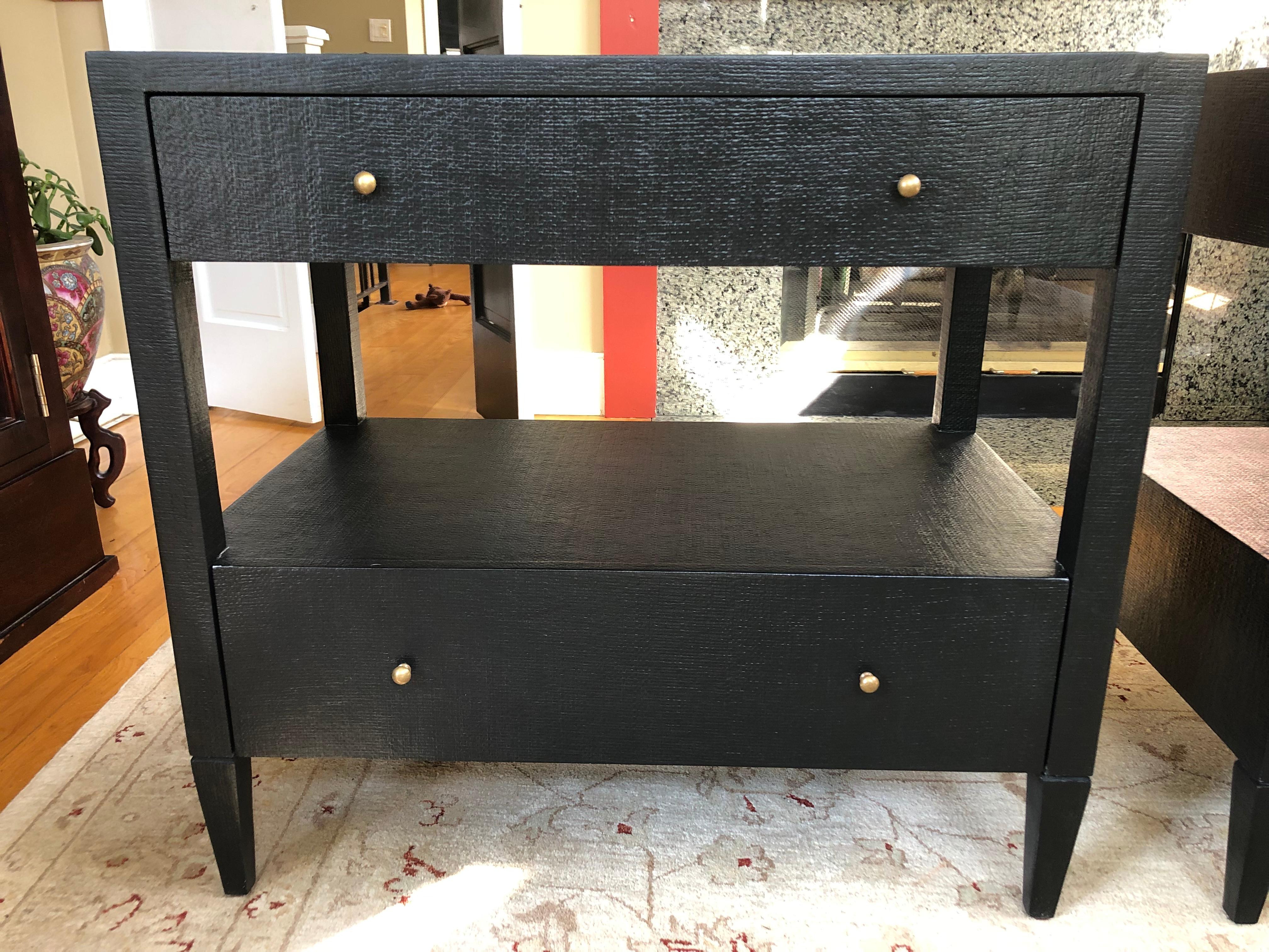 Stunning contemporary pair of black faux raffia textured nightstands having two tiers with drawers. Conrad nightstands by made goods in like new condition.