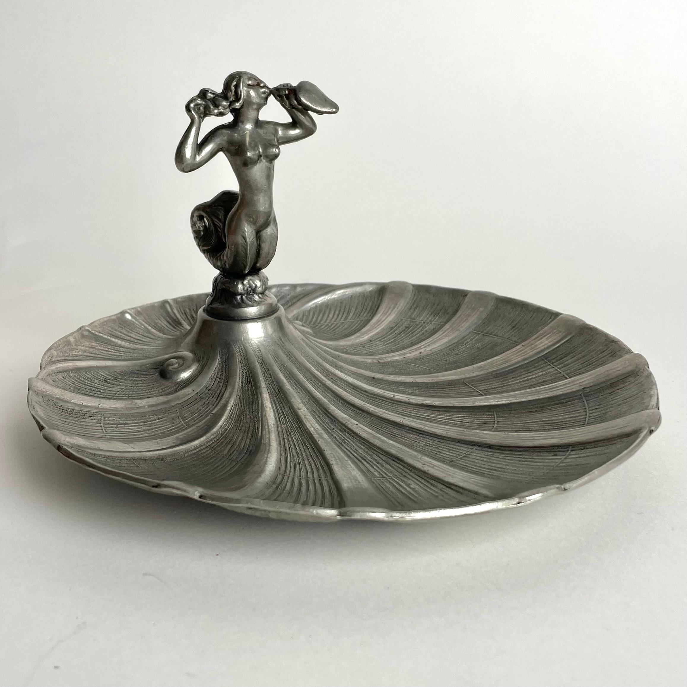 Sophisticated Pewter Serving Dish from GAB, Guldsmedsaktiebolaget in very period Swedish Grace design. Decorated with a mermaid in a shell.  Made in Sweden during the 1920s.

Wear consistent with age and use 