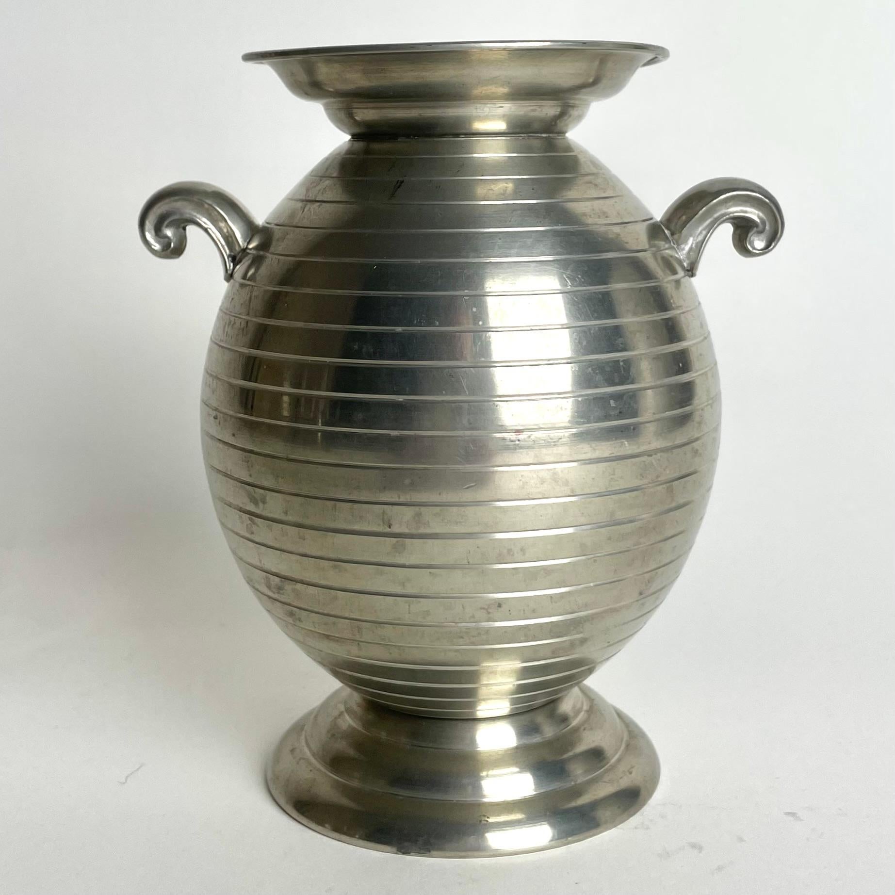 Sophisticated pewter vase in Swedish Grace. Made by J.L. Hultman in Stockholm, Sweden and dated 1936 (K8). The vase is simply and elegantly decorated in a period design.

Wear consistent with age and use