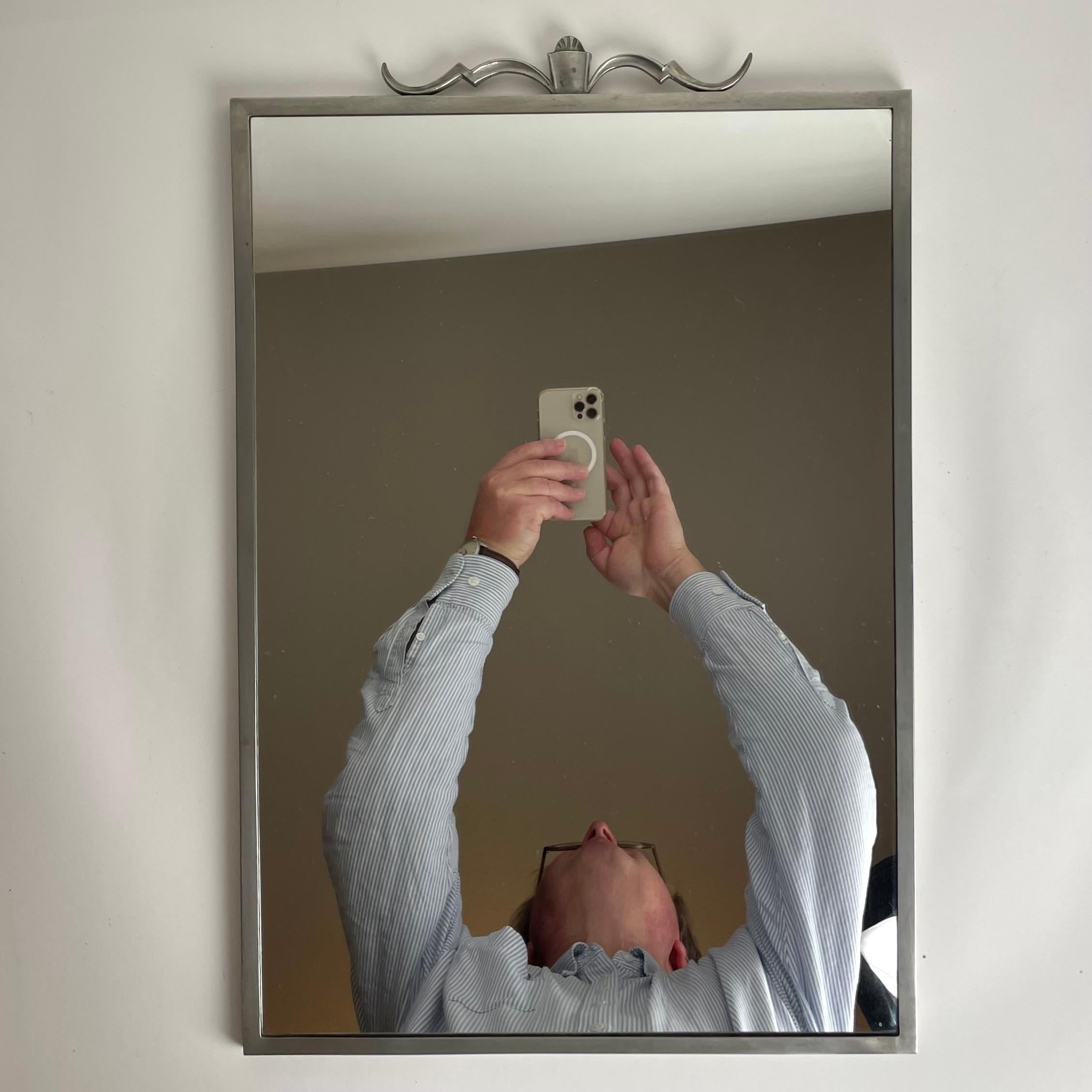 Sophisticated Pewter Wall Mirror designed by Edvin Ollers (1888-1959) and manufactured by Schreuder & Olsson, Stockholm in period Swedish Grace from 1928 (=B8)

Wear consistent with age and use 