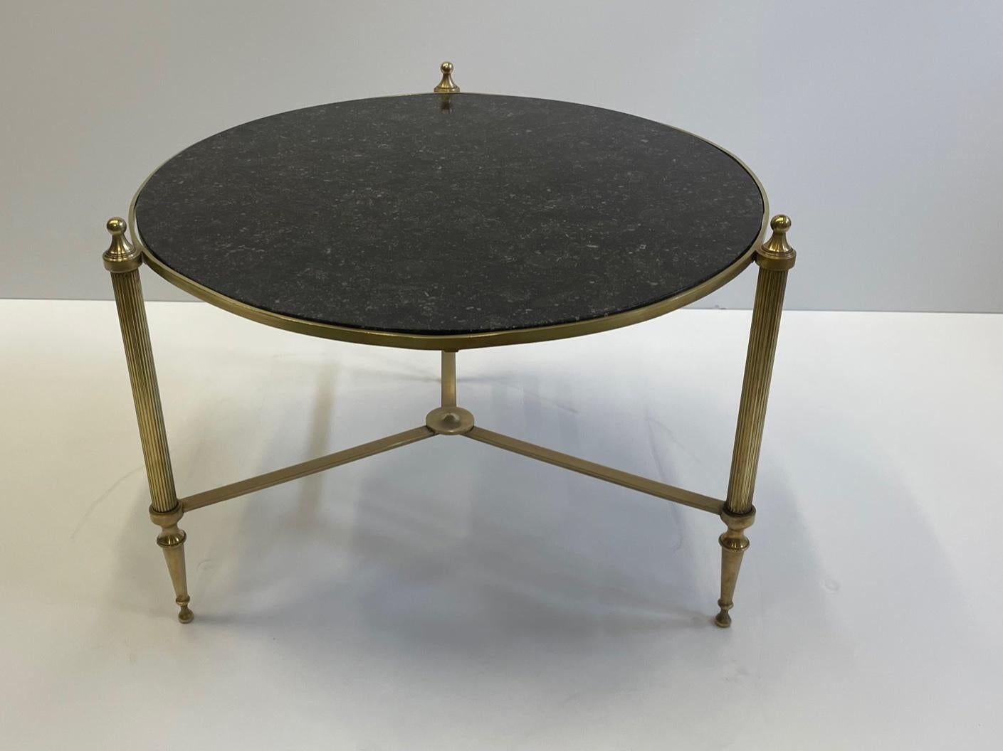Sophisticated Round Maison Jansen Style Brass Coffee Table with Black Marble Top In Good Condition In Hopewell, NJ