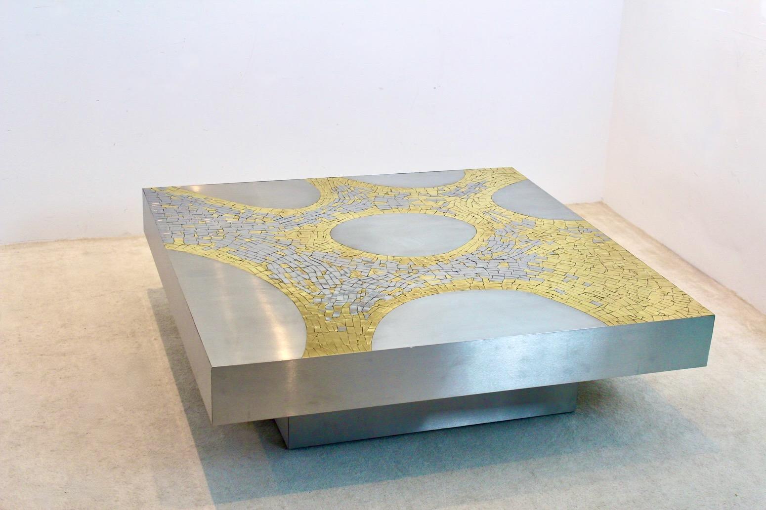 Impressive brushed stainless steel and brass square coffee table, designed and signed by Jean Claude Dresse, Belgium, circa 1970. An extraordinary piece, crafted with great eye for proportions and detail, typical for the work of Dresse. The
