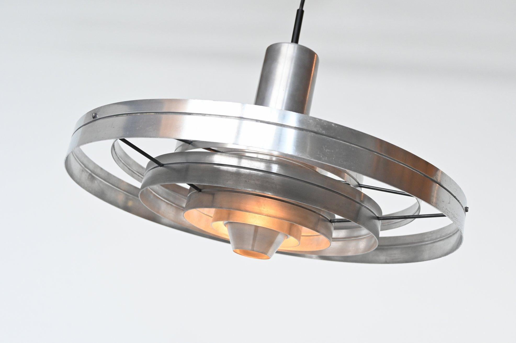 Amazing pendant lamp model Fibonacci designed by Sophus Frandsen and manufactured by Fog & Morup, Denmark, 1965. This lamp is made of six concentric brushed aluminium circles, connected with metal rods and a shade in the centre. It gives a softly