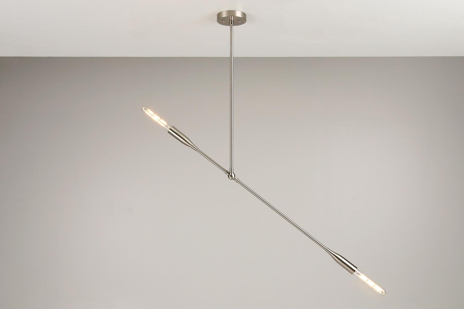 The Sorenthia Light is a modern, linear pendant with bold, elegant lines and dramatic negative space. One Sorenthia Light in Brushed Nickel is available now at a 50% discount. This is a floor model with minor finish flaws consistent with normal wear