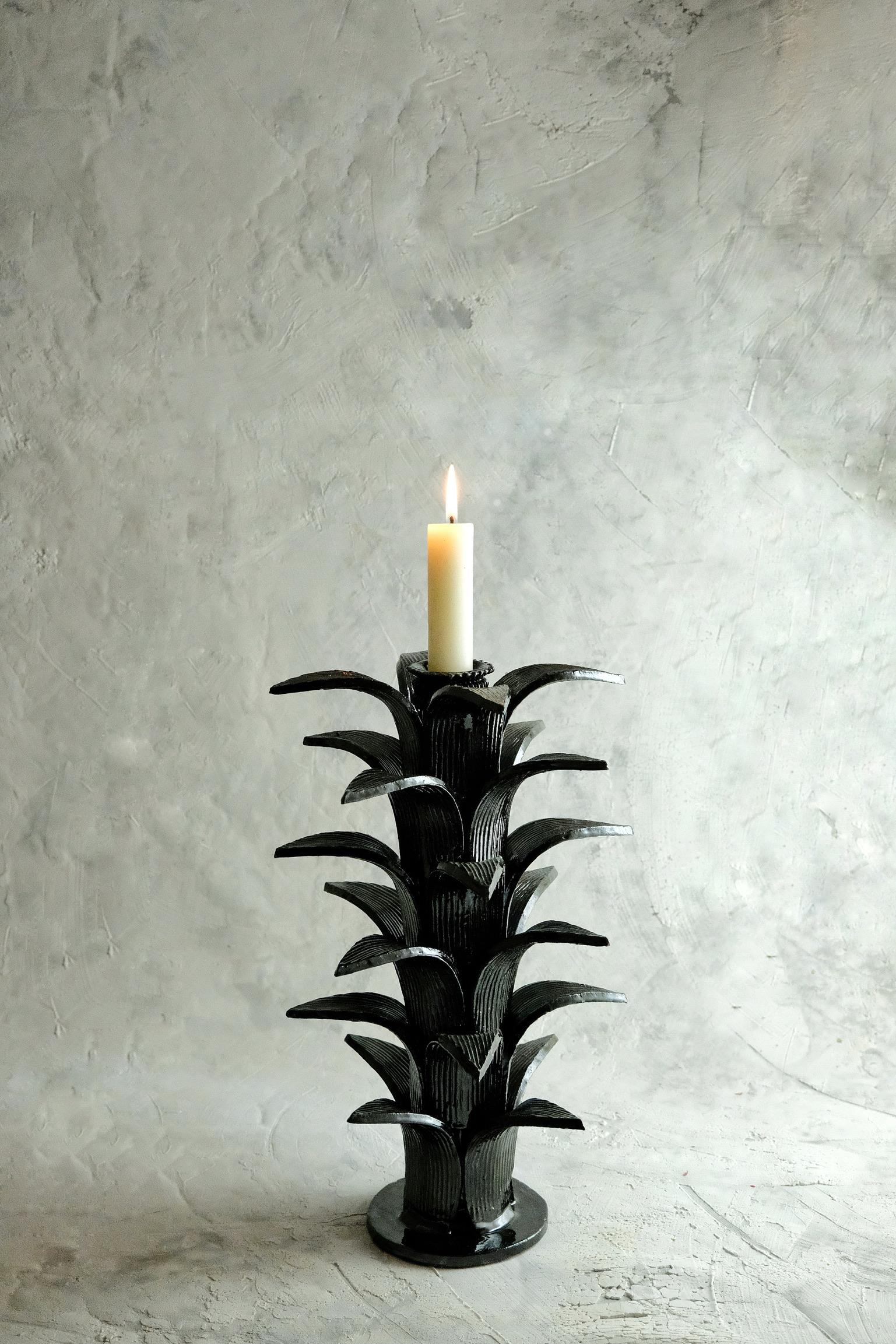 Sorgo Candleholder by Onora
Dimensions: D 23 x H 38 cm
Materials: Clay, Quartz stone

Available in black, green, blue and yellow. 
Hand made in the town of San Jose de Gracia, Michoacan, Once the piece has been completely molded, a white based