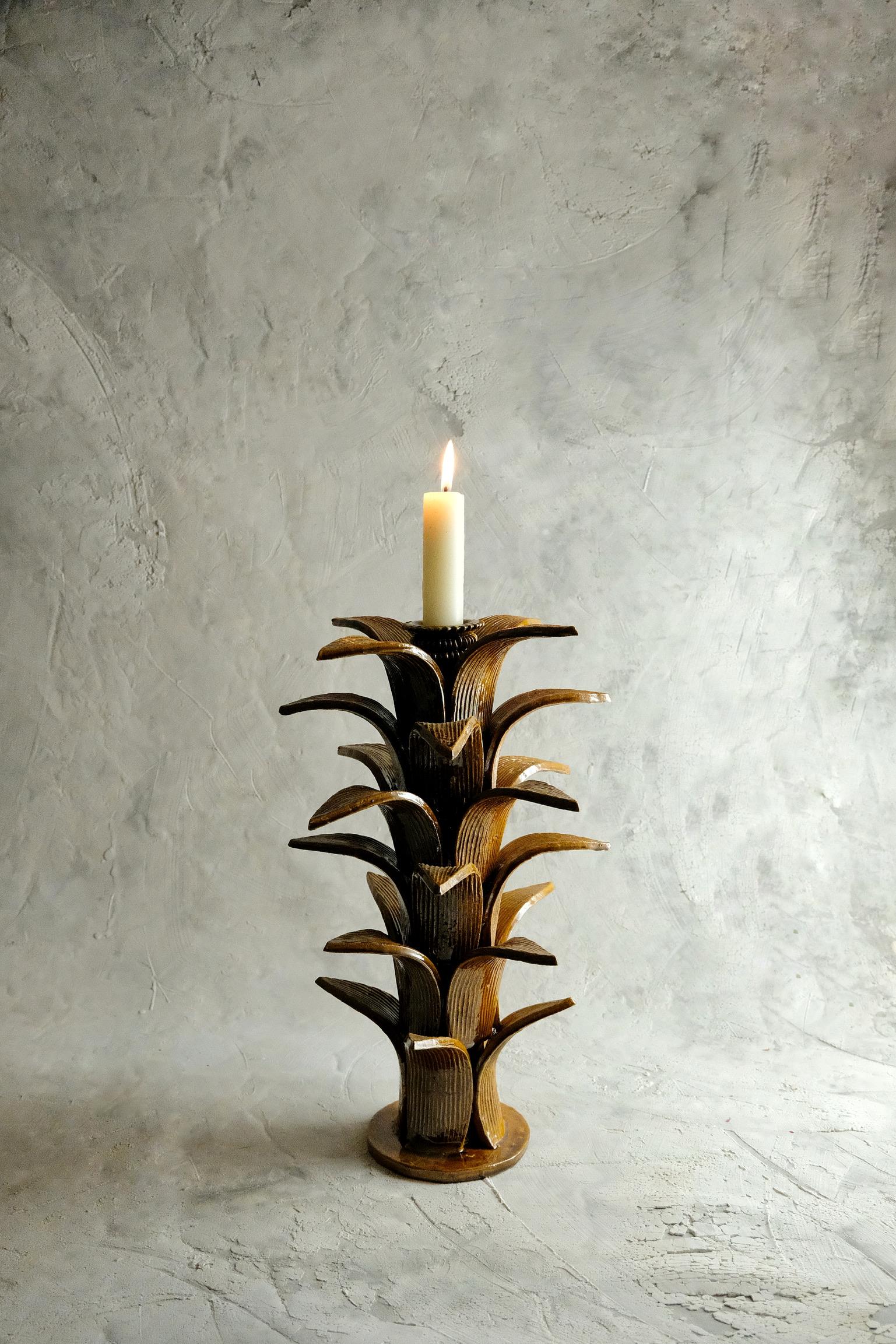 Sorgo candleholder by Onora
Dimensions: D 23 x H 38 cm
Materials: Clay, Quartz stone

Available in black, green, blue and yellow. 
Hand made in the town of San Jose de Gracia, Michoacan, Once the piece has been completely molded, a white based