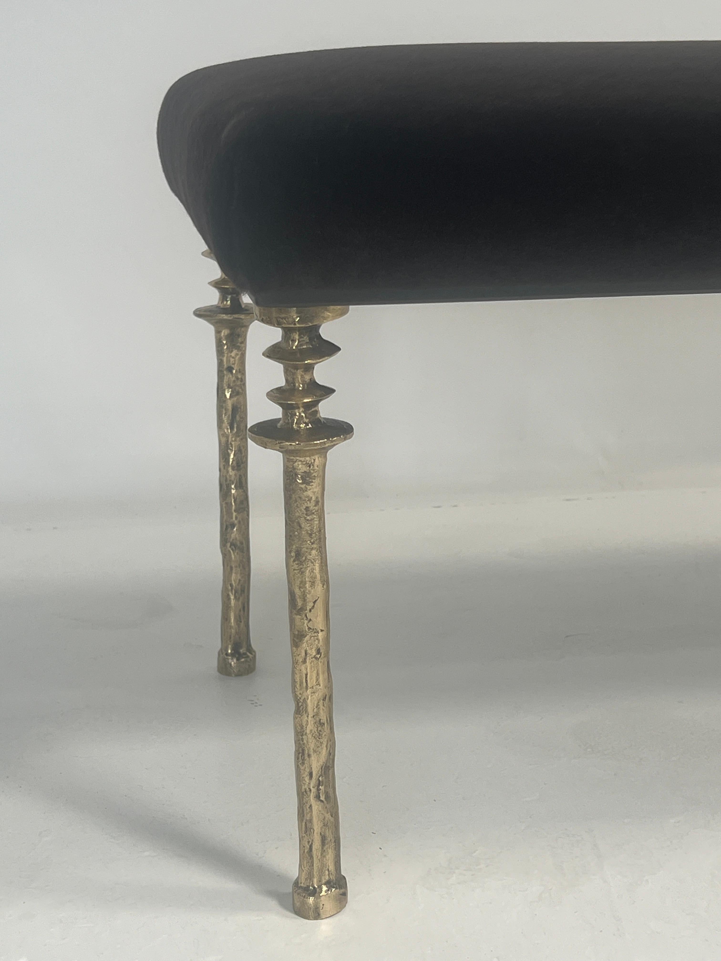 Inspired by Diego Giacometti, this bench is ideal for those who are looking for unique seating. Their cast gold bronze legs provide a truly organic touch. The seat can be upholstered in a variety of materials to meet your design scheme.