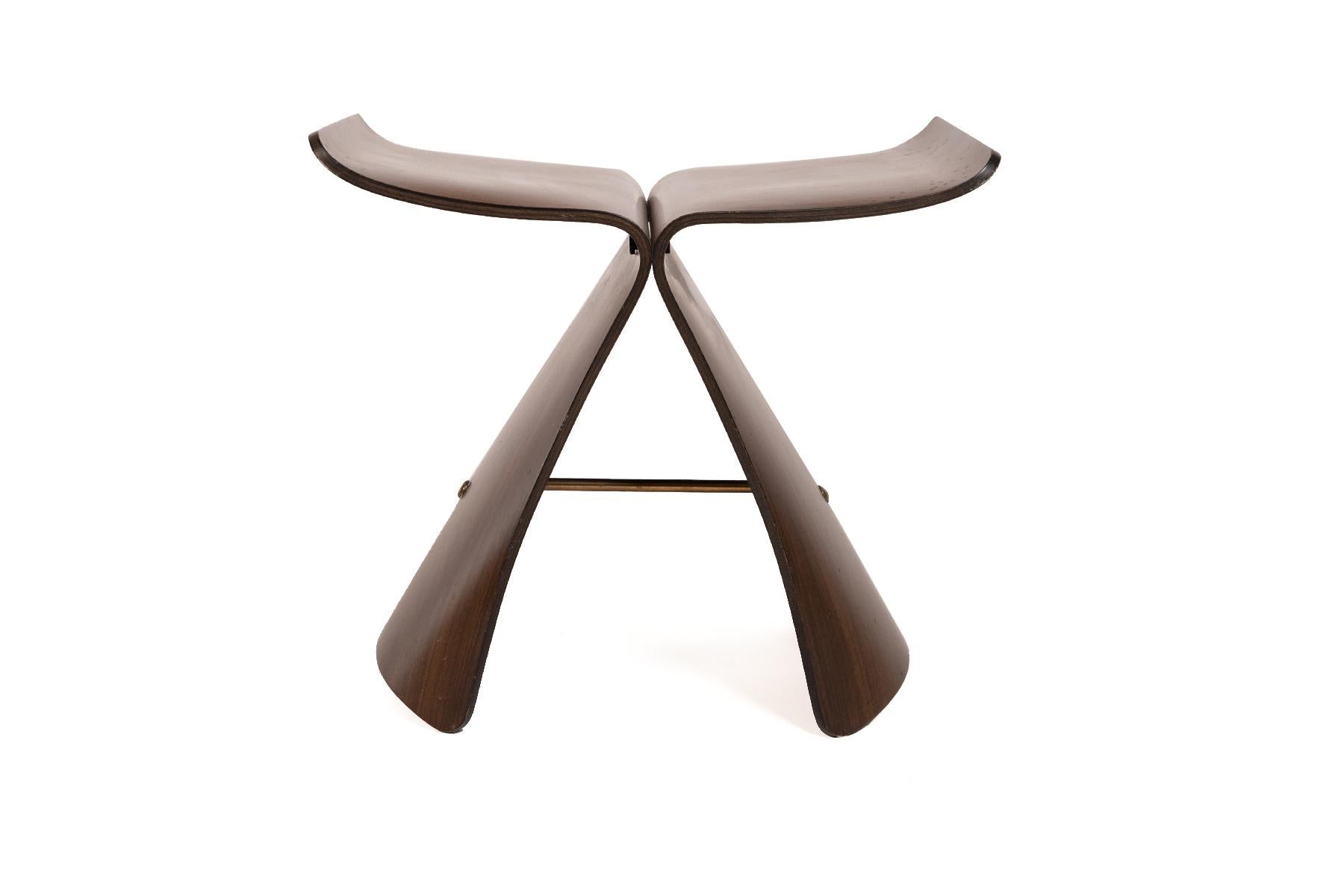 A Sori Yanagi butterfly stool for Tendo in bent rosewood and brass. Marked with label.