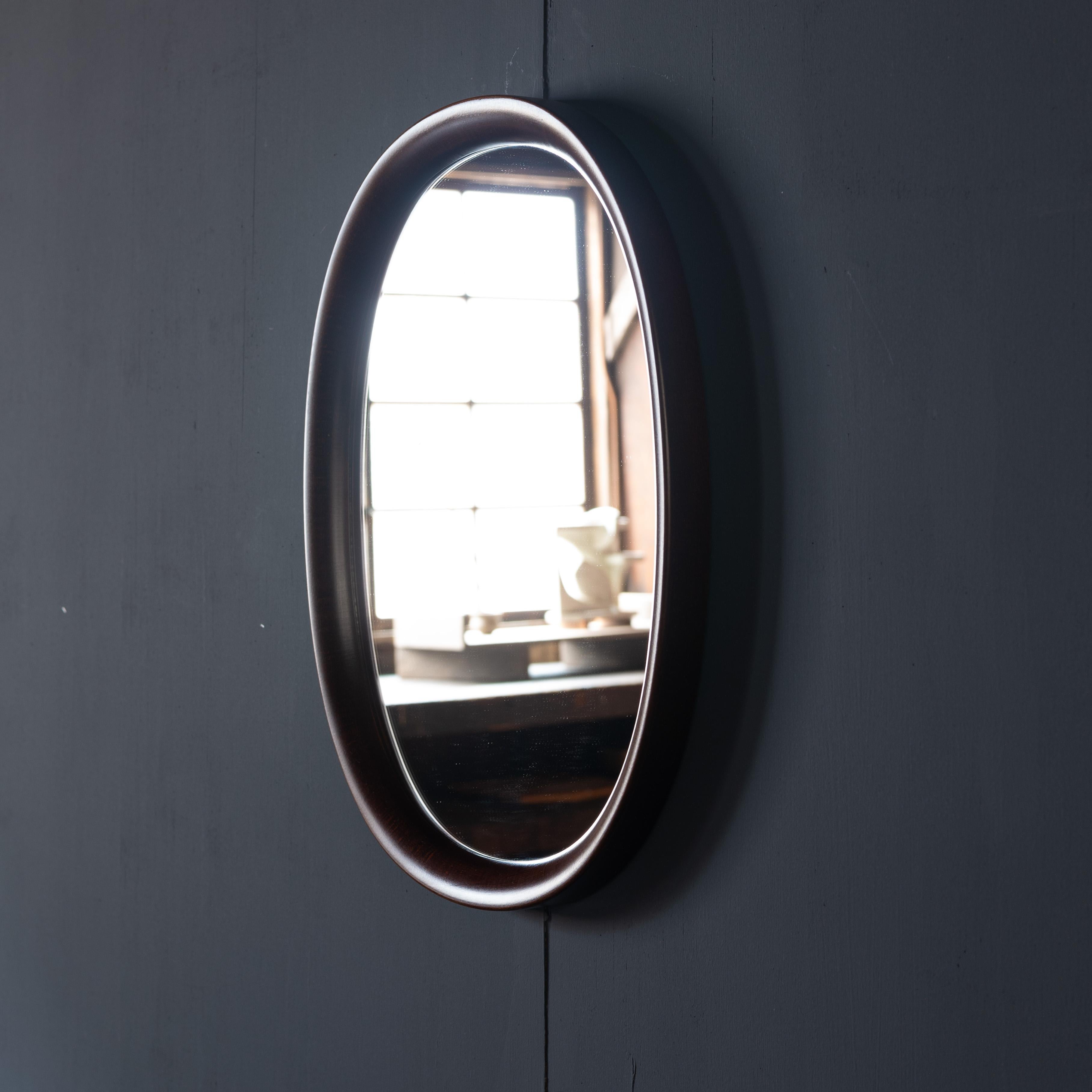Wall hanging mirror that was designed by Sori Yanagi in 1977 and manufactured by Akita Mokko. There is only one seam in the frame, which shows Akita Mokko's excellent technique.

SORI YANAGI - was born in 1915 in Tokyo as a son of Soetsu Yanagi, a