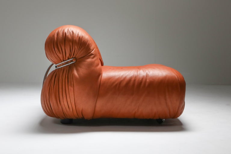 Afra and Tobia Scarpa, reupholstered cognac aniline leather, Cassina, Italy, 1970s

The Soriana collection was meant to express beauty and comfort by using a whole bundle of fabric held by a chrome-plated steel clamp.
The 