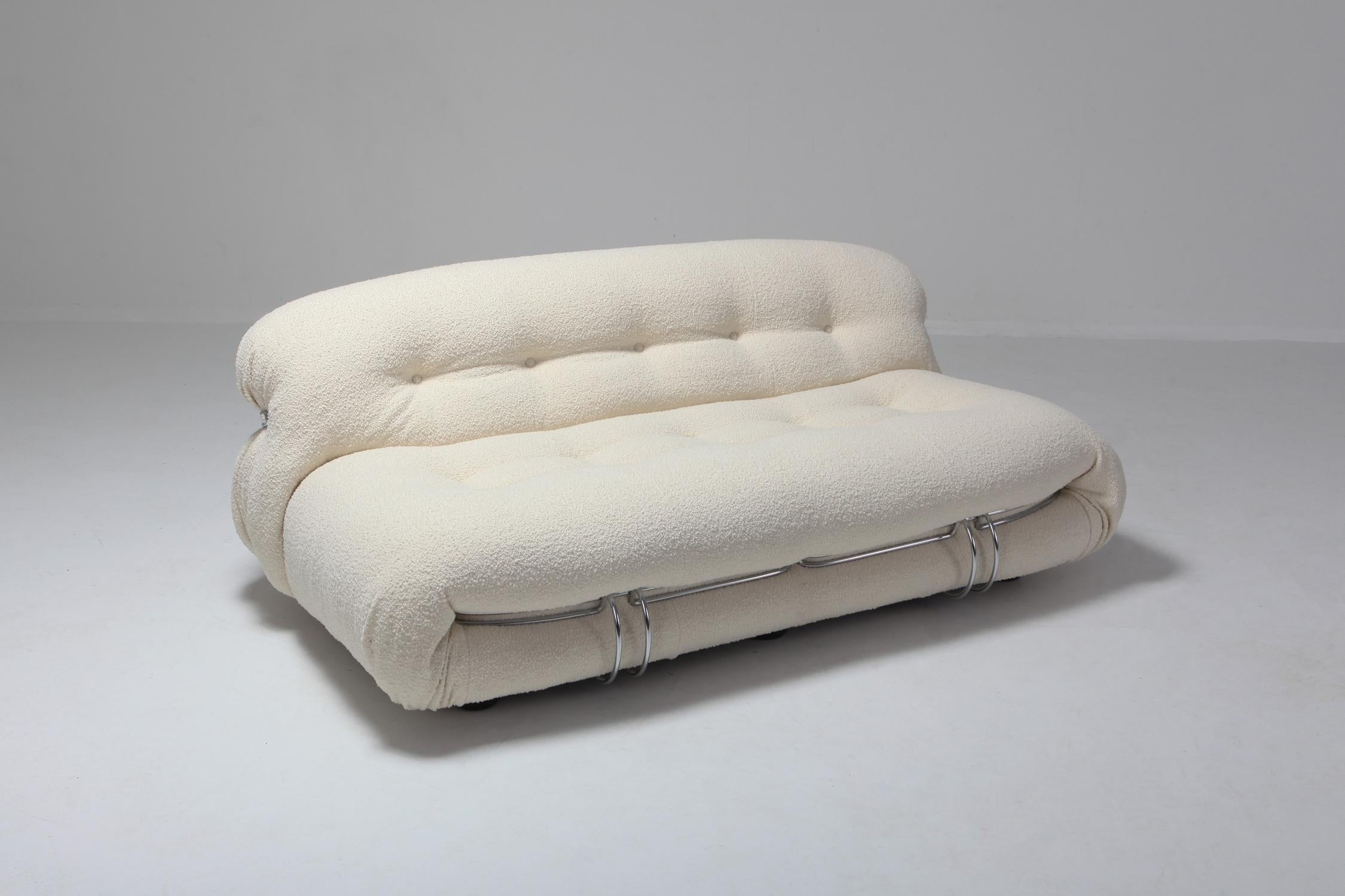 Manufactured by Cassina in the 1970s, the Soriana collection was meant to express beauty and comfort by using a whole bundle of fabric held by a chrome-plated steel clamp.
Reupholstered in ivory bouclé wool.
The 
