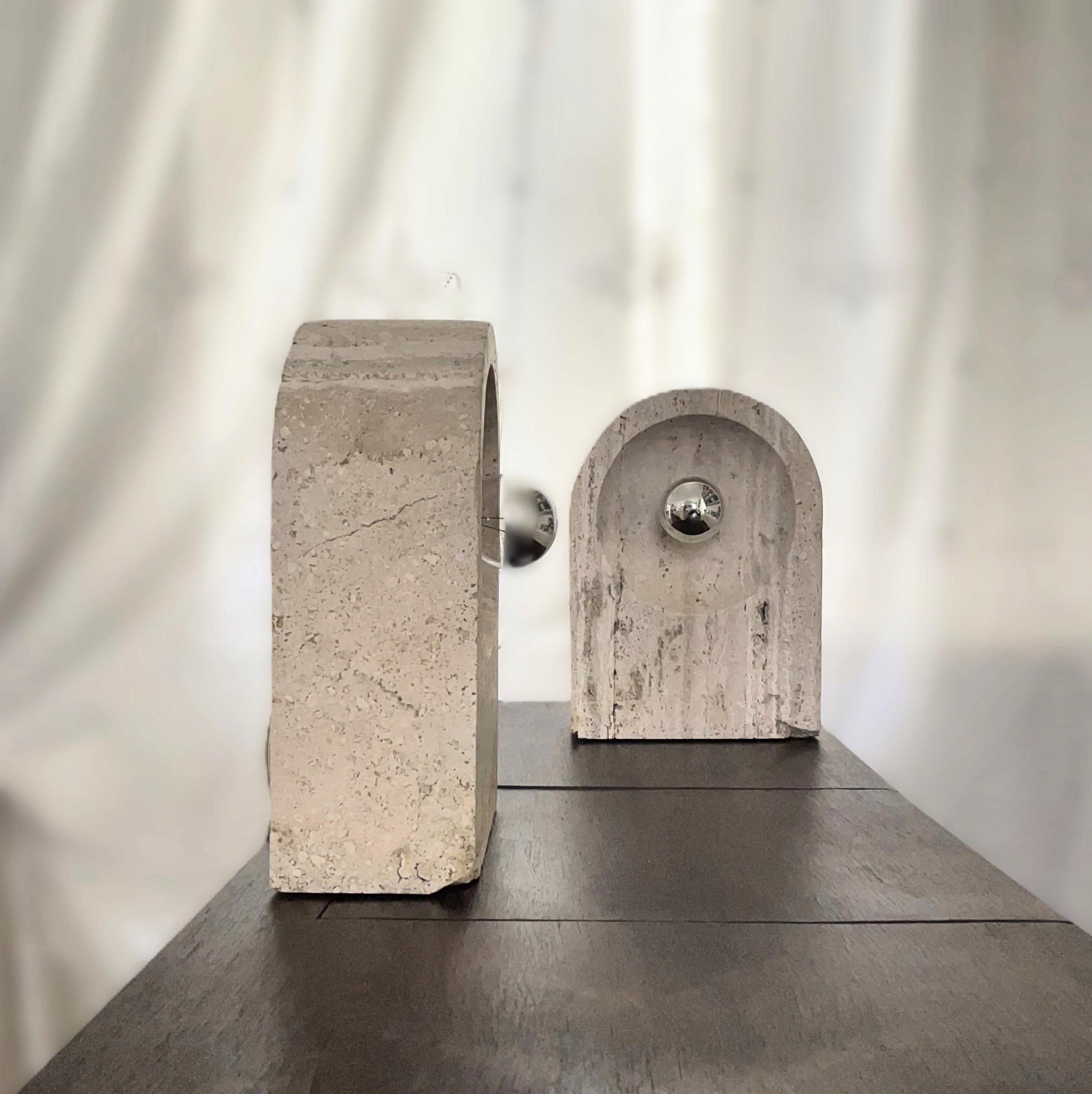 This pair of vintage travertine table lamps represents the very first original prototypes designed by Giuliano Cesari for Sormani in the early 1970s. They were created as part of the company's Nucleo Division, an experimental design initiative