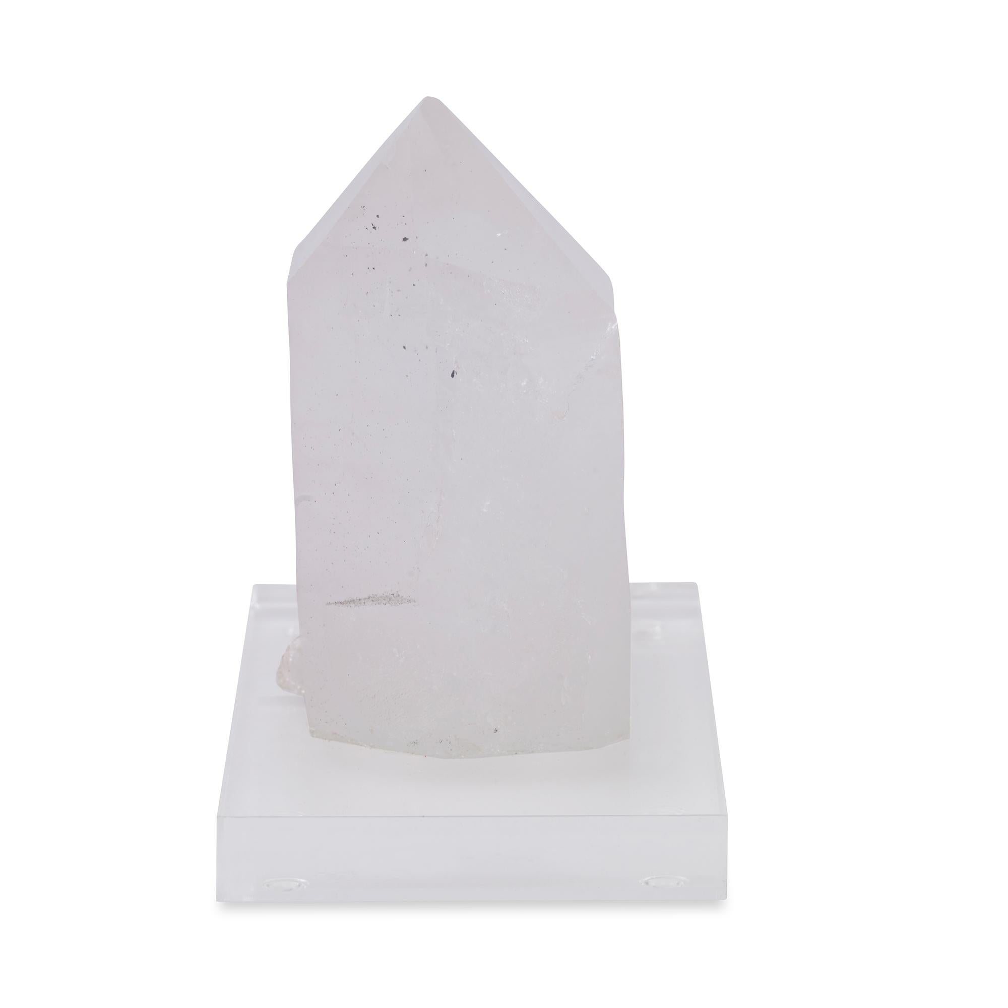 A white crystal point mounted on a clear acrylic base. Due to the natural material variation in size shape and color is to be expected.
      