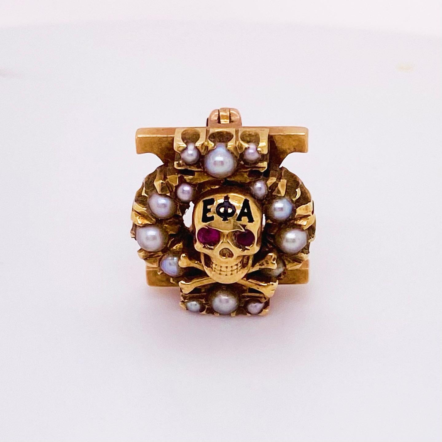 The details for this beautiful brooch is listed below:
Metal Quality: 10k Yellow Gold 
Broach Shape: 
Broach Measurements: 11.7 mm 
Gemstone: Pearl 
Gemstone Shape: round 
This sorority pin is for the Chi Omega and is a skull with ruby eyes and seed