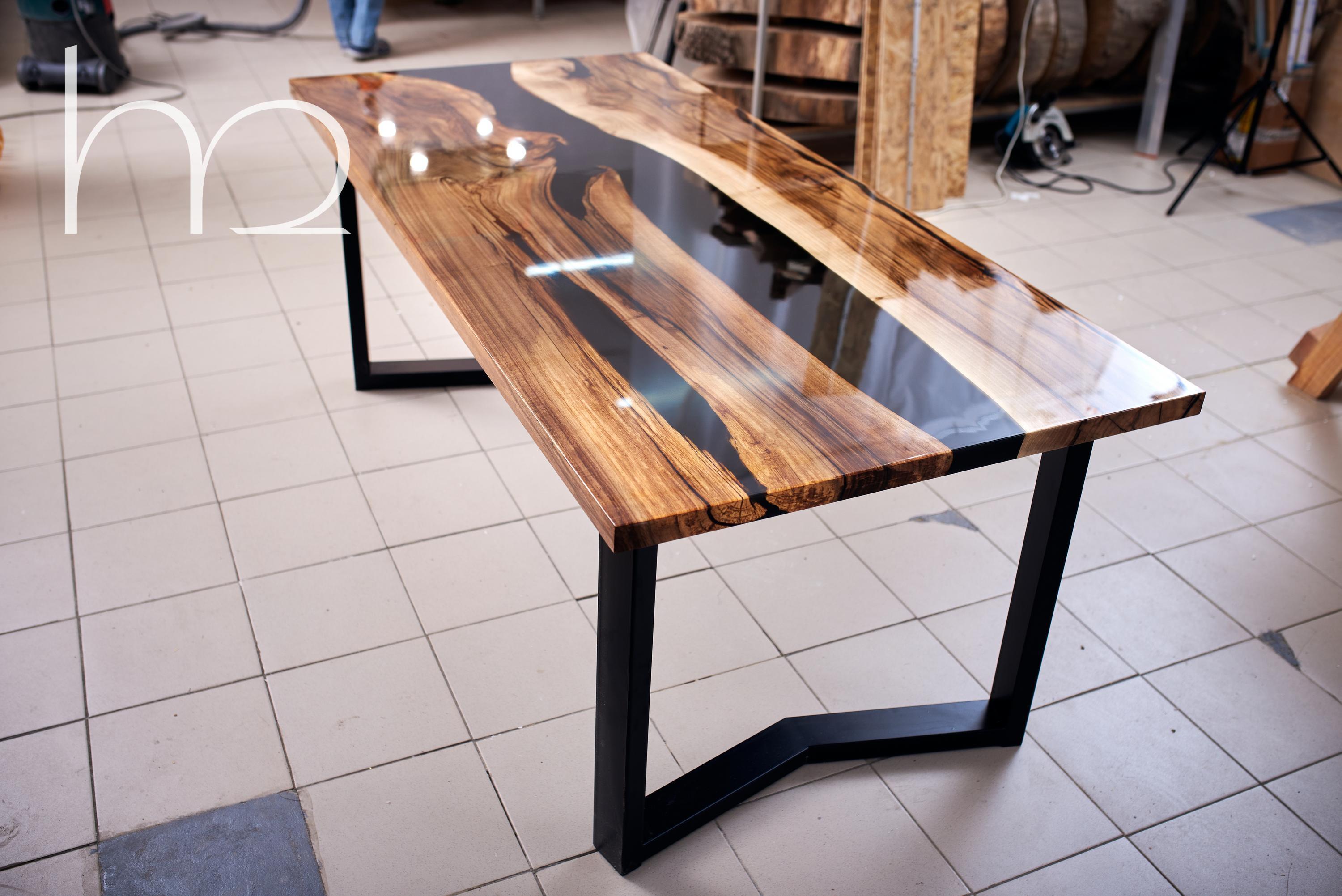 Ancient slabs of rotten walnut shrouded in the darkness of black epoxy. Every crack and every authentic feature of the old wood is accentuated with pitch black as darkness itself. The table turned out with its own special character. I am sure that