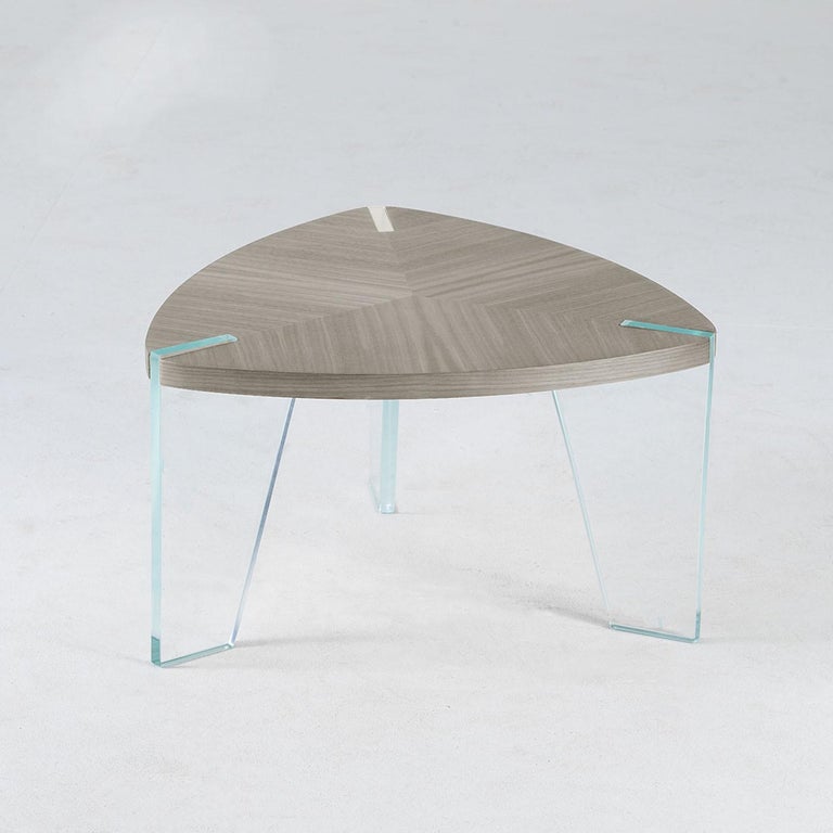 Illusion combines with the substance of traditional solid wood processing. The Sospeso solid wood coffee table is created by the expert hands and vision of our artisans. The linear and formal design of the wooden top worked with inlay technique
