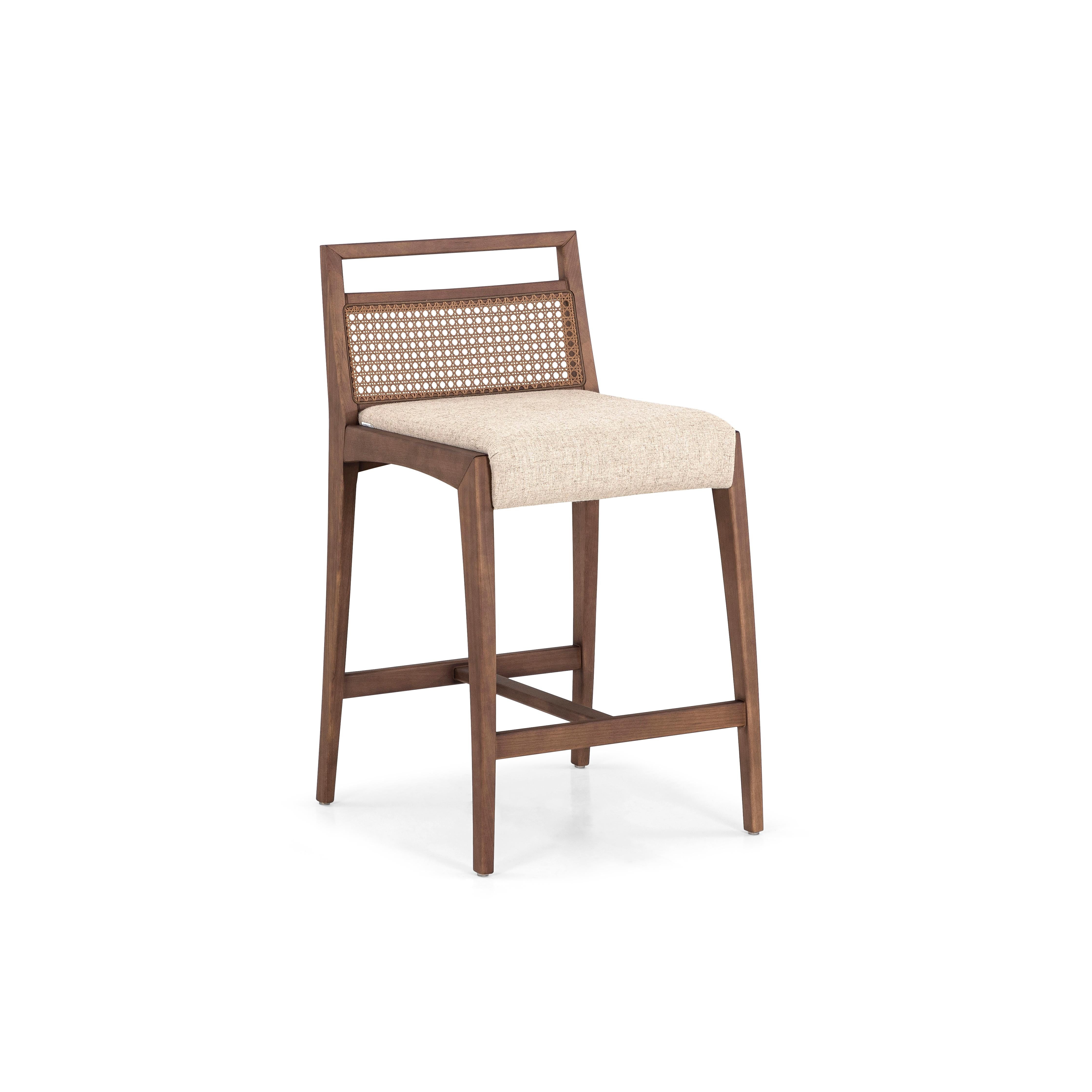 The Sotto counter stool is a piece that is designed with a taller high to use at a countertop or a high table. This chair has striking features, where resistance and delicacy meet. Designed with a walnut finish wood legs and frame, a beige fabric