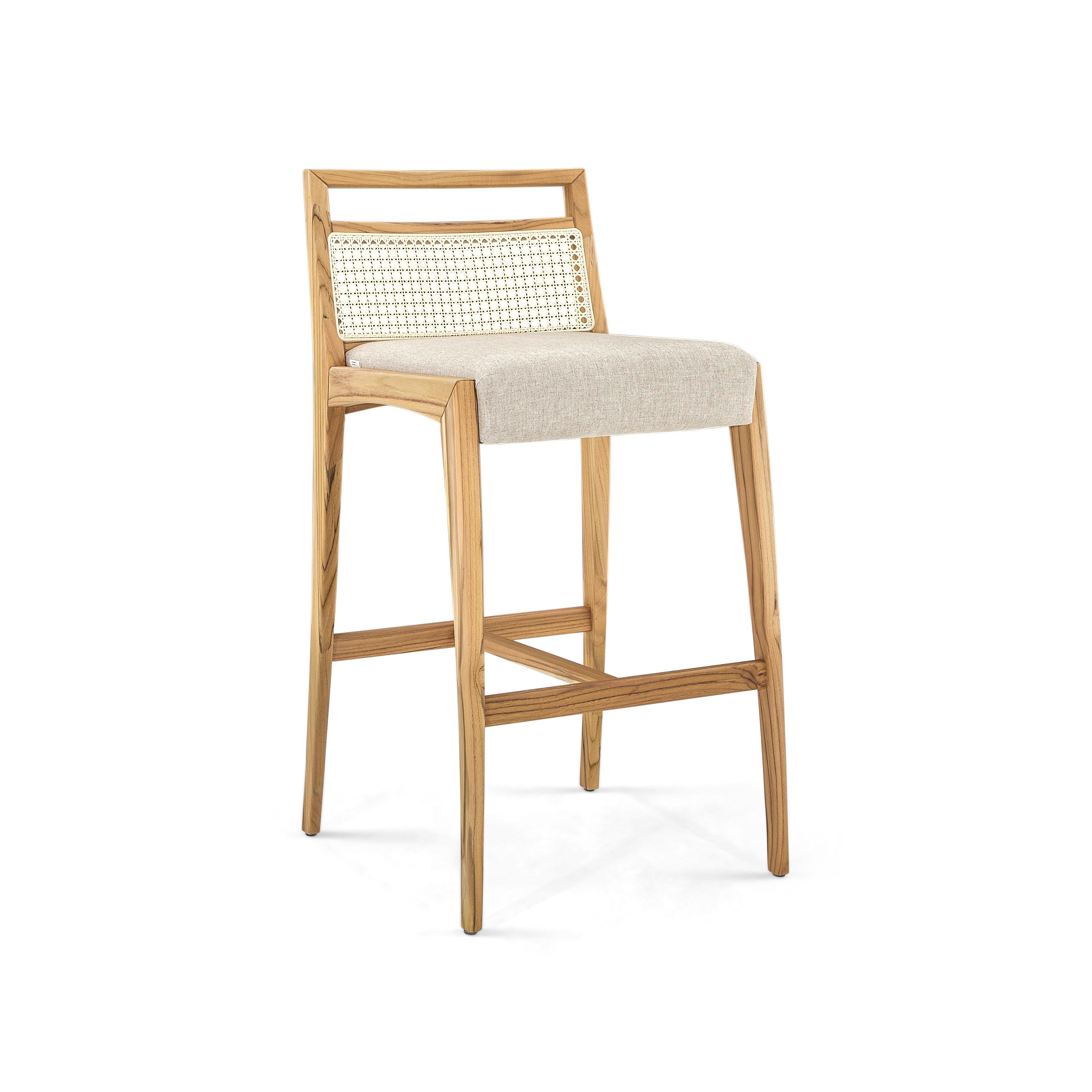 The Sotto counter stool is a piece that is designed with a taller high to use at a countertop or a high table. This chair has striking features, where resistance and delicacy meet. Designed with a walnut finish teak legs and frame, a beige fabric