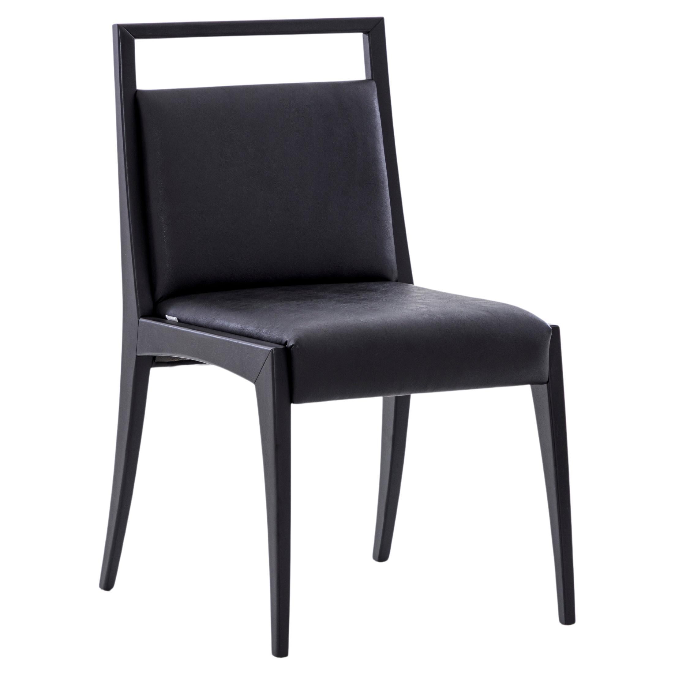 Putting a lot of effort our amazing Uultis team has created the Sotto dining chair, thinking of every possible detail like the open top rail in a black wood finish that goes perfectly with the black fabric. This pair of chairs are beautiful and