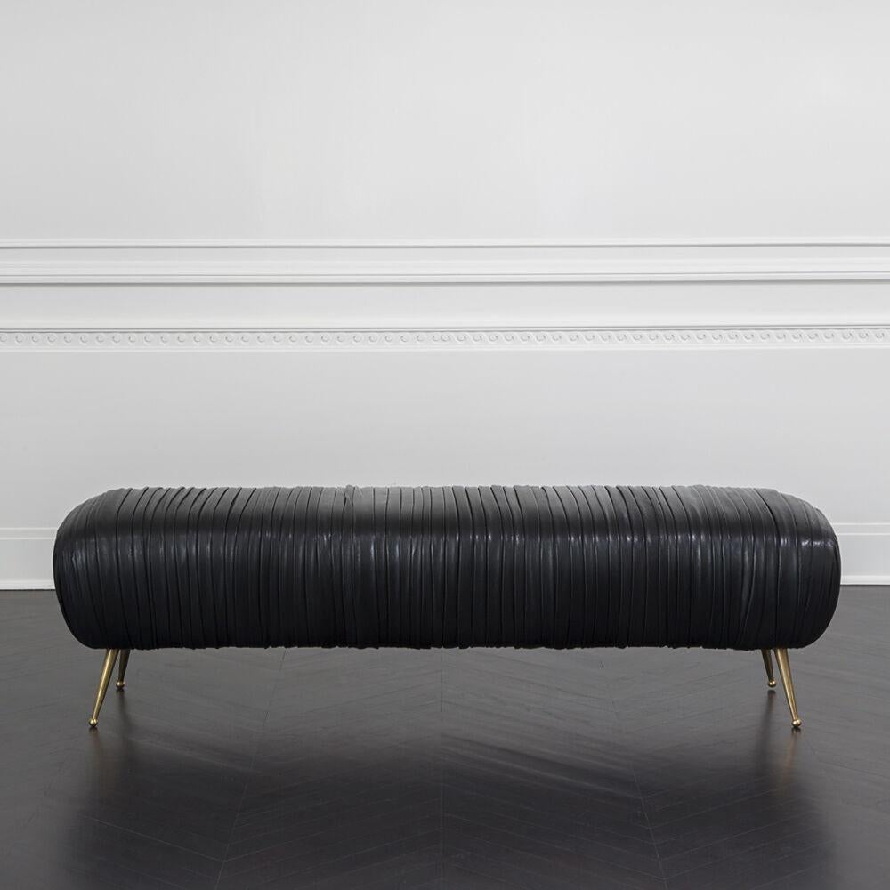 The delicate lines of the Souffle bench are created by a signature ruched leather detail. Full-finish, vegetable-dyed lambskin is hand-stitched on to the frame. His exquisitely detailed and luxurious bench sits on tapered legs of solid cast bronze.