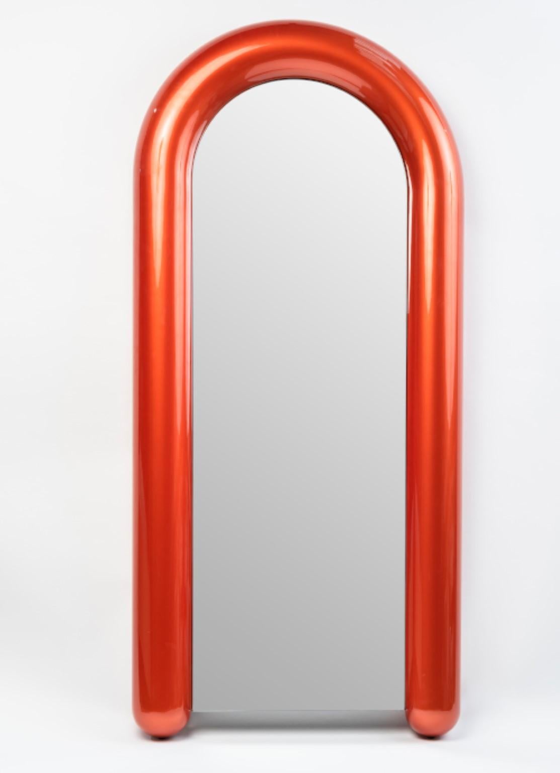 Soufflé mirror by Luca Nichetto 
Dimensions: W91.5 x D16 x H200 cm
Materials: Liquid painted menthol chrome/coral chrome/prune chrome metal structure

With a playful design and puffy appearance, the Soufflé mirror lives up to its name, further