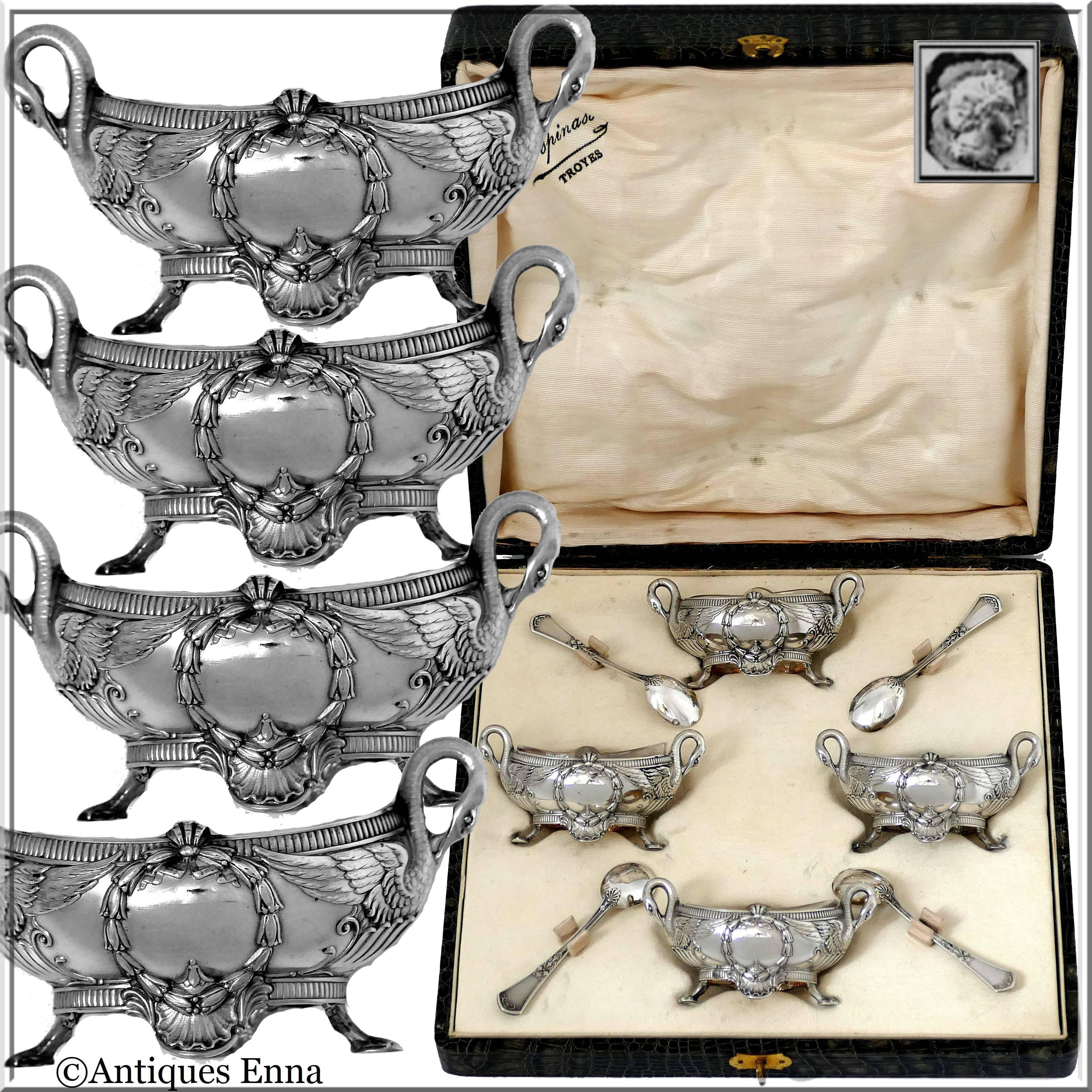 Head of Minerve first titre for 950/1000 French sterling silver guarantee. 

Fabulous French sterling silver salt cellars four-pieces. Each ornately decorated in Empire styling with laurel wreath, shell and swan-shaped handles. No monograms. This