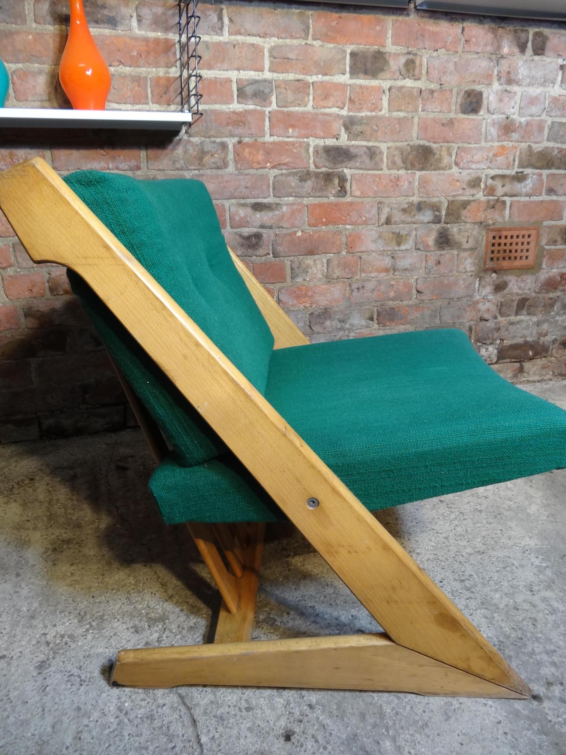 This solid Dutch Z shaped framed chair comes with green fabric cushions, in the style of Gerrit Rietveld this classic Dutch chair are the antiques of the future and look great in any decor.

Measures: Seat height 42cm, height 75cm, depth 70cm,