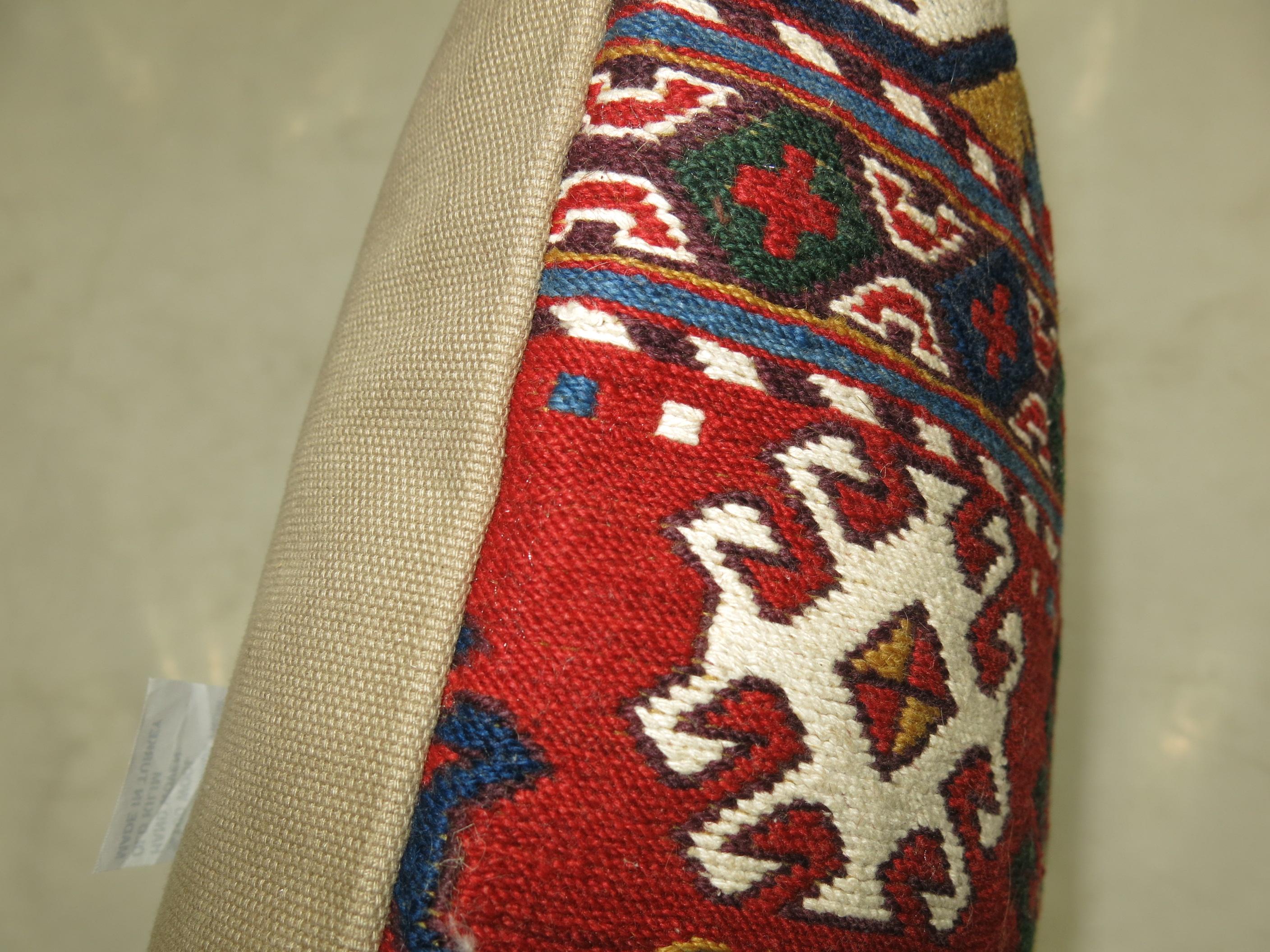 Pillow made from a colorful vintage Persian Kilim flat-weave.

17'' x 17''