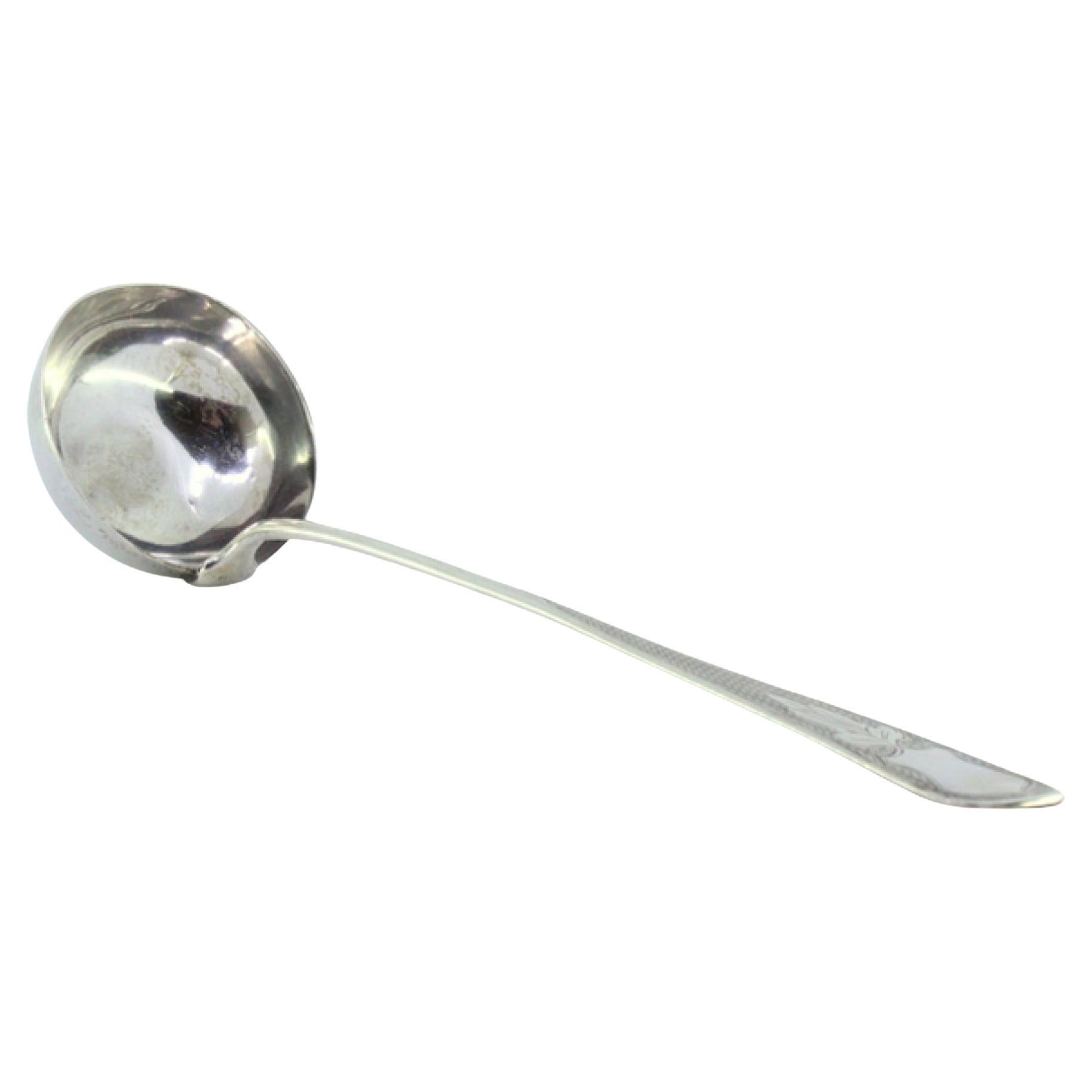 Soup ladle in guilloche silver on the handle to be dispatched w/ a monogram card
