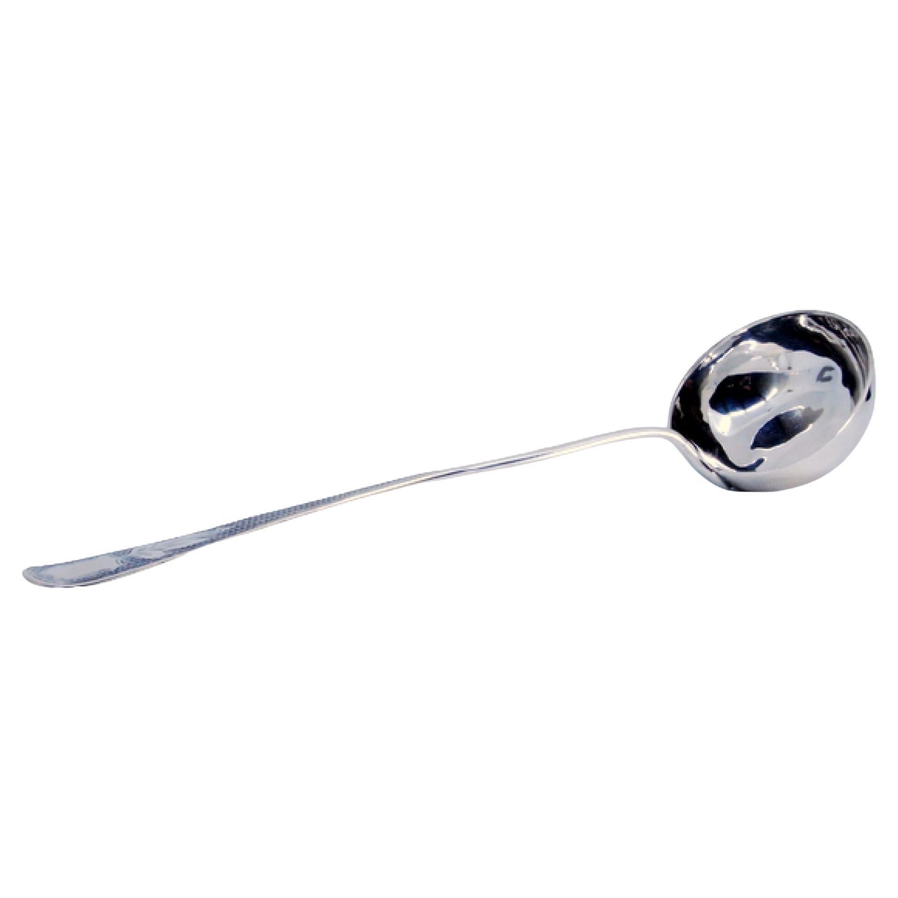 Soup ladle in guilloche silver on the handle with palm surrounding monogram card