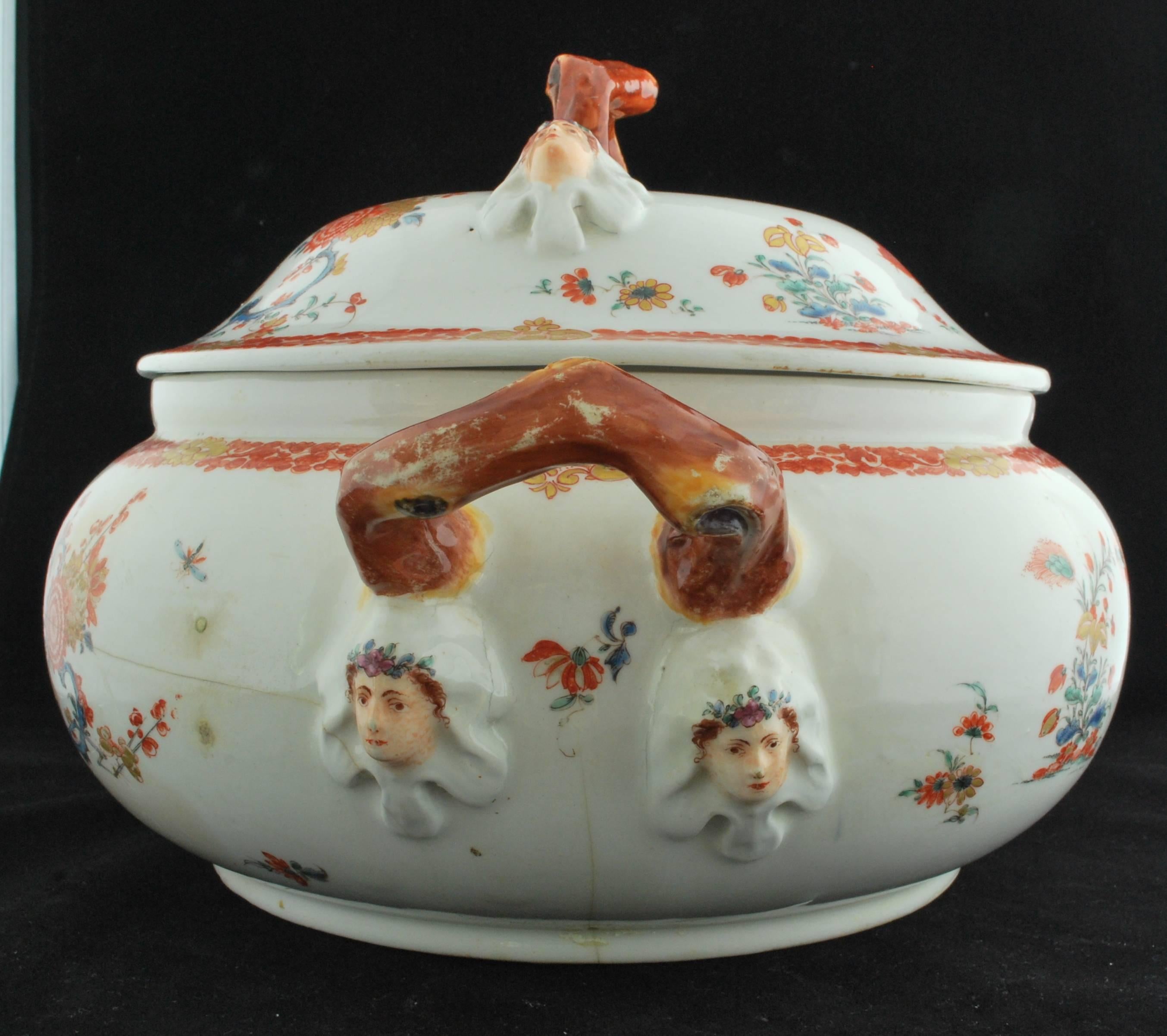 Oval tureen and cover, decorated after the Kakiemon in the two quail pattern; the crabstock handles and masks are interesting features. The tureen has had a rather unhappy life, apparently having been put down on a hot stove at least once; but has