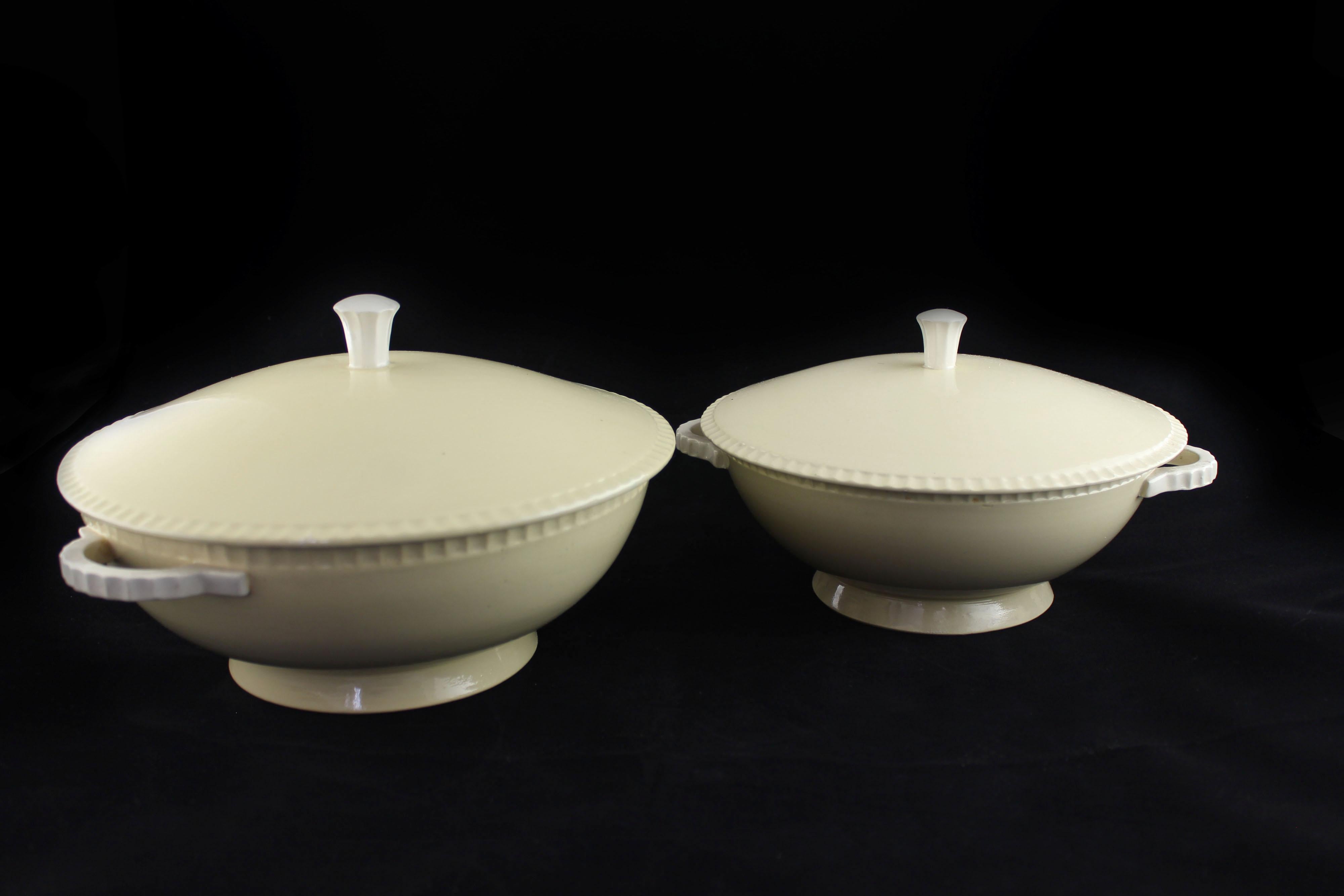 Delicious cream-colored art deco soup tureens with ivory details same height 2 different sizes. H16 the big one 30X26 the small one 27X23