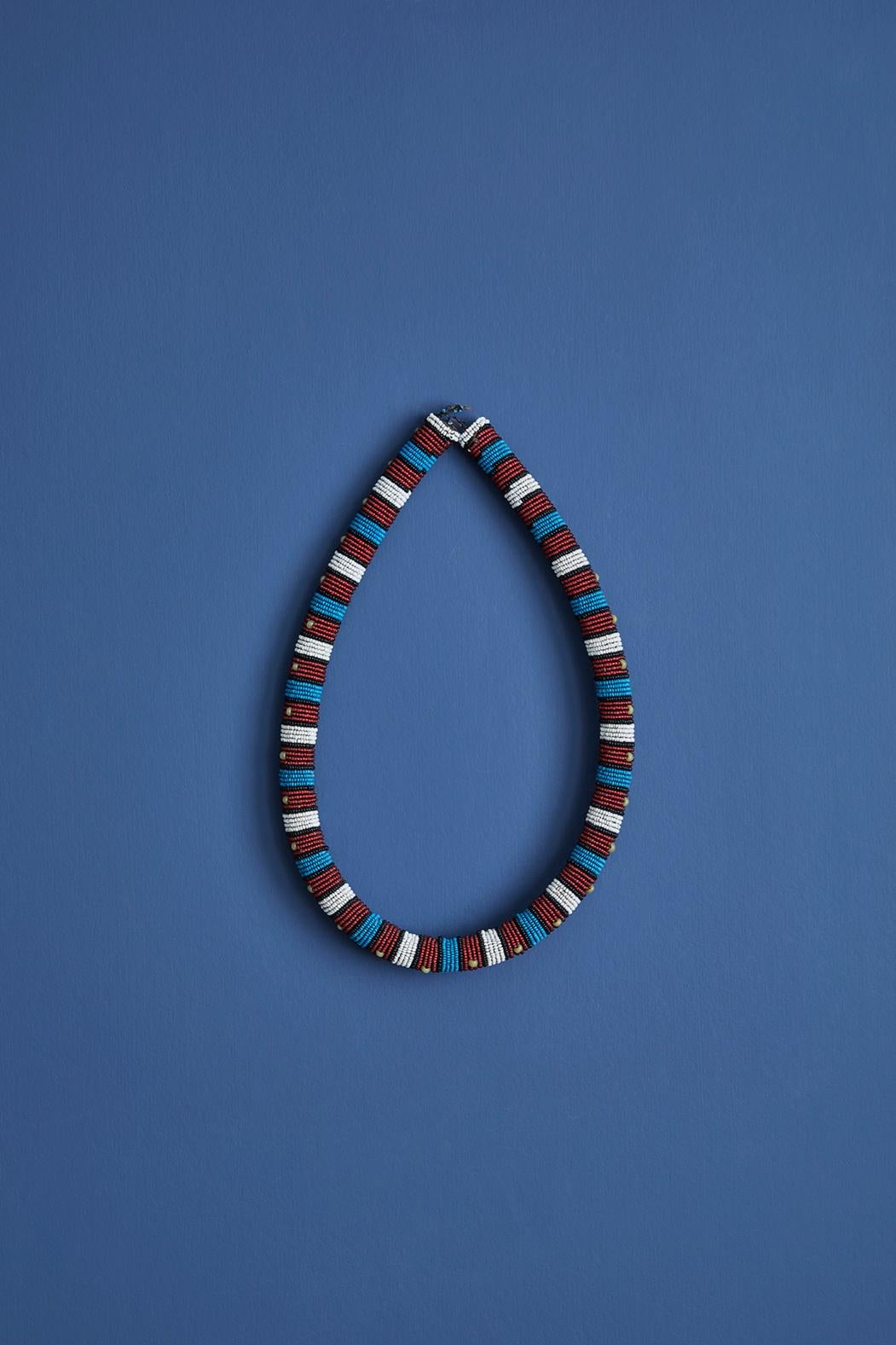 South African Zulu beaded collar necklace from the early 20th century. 

The collar measures 80 cm long and 2.2 cm in diameter. 

Zulu beadwork has a long history as beads were traded first by Arabs and later Europeans in exchange for ivory,