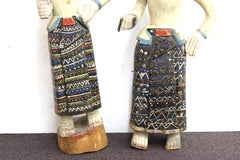 South-East Asian Carved and Painted Wood Figures of Men in Sarongs
