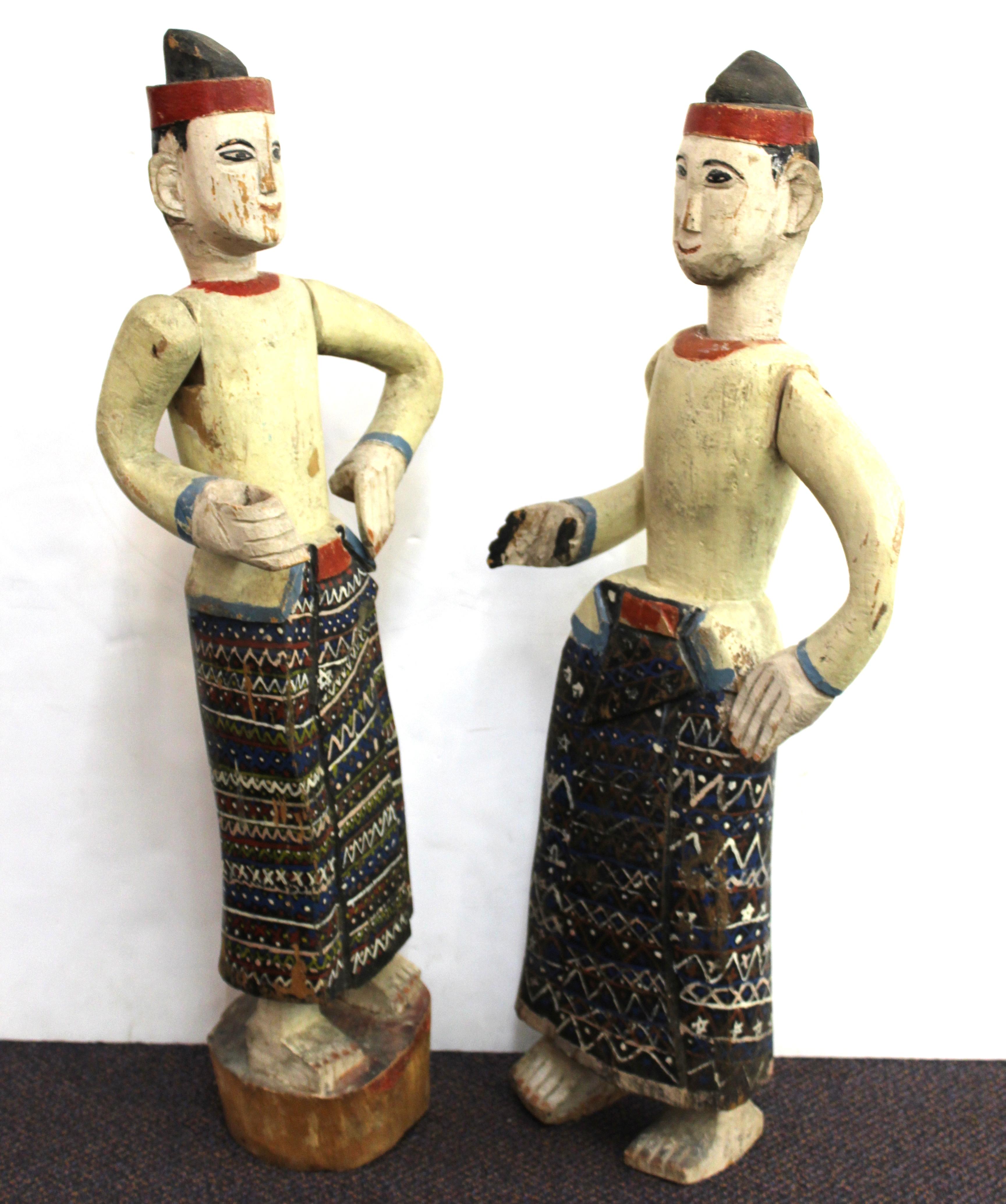 Tribal South-East Asian Carved and Painted Wood Figures of Men in Sarongs