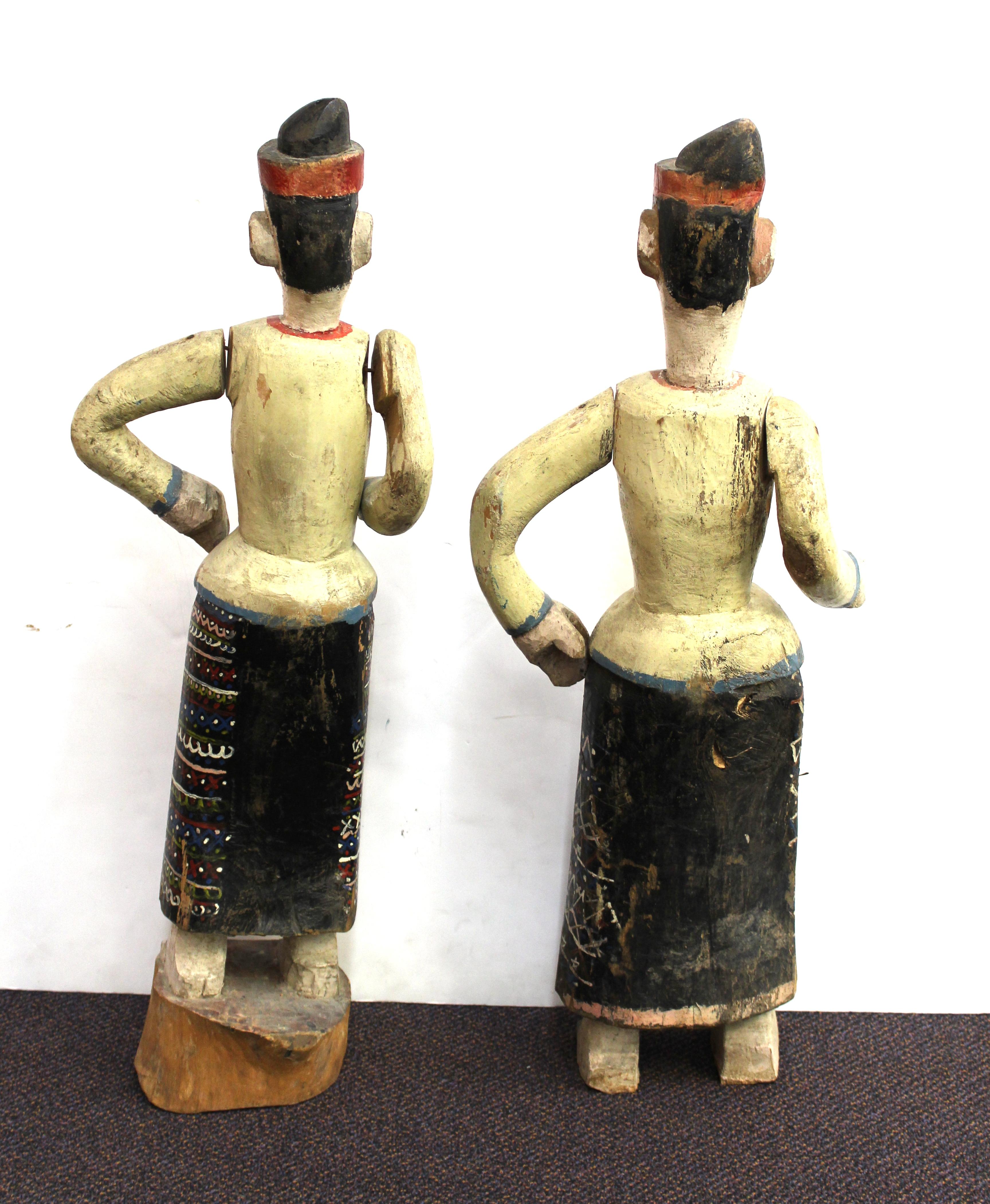 South-East Asian Carved and Painted Wood Figures of Men in Sarongs In Good Condition In New York, NY