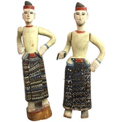 South-East Asian Carved and Painted Wood Figures of Men in Sarongs