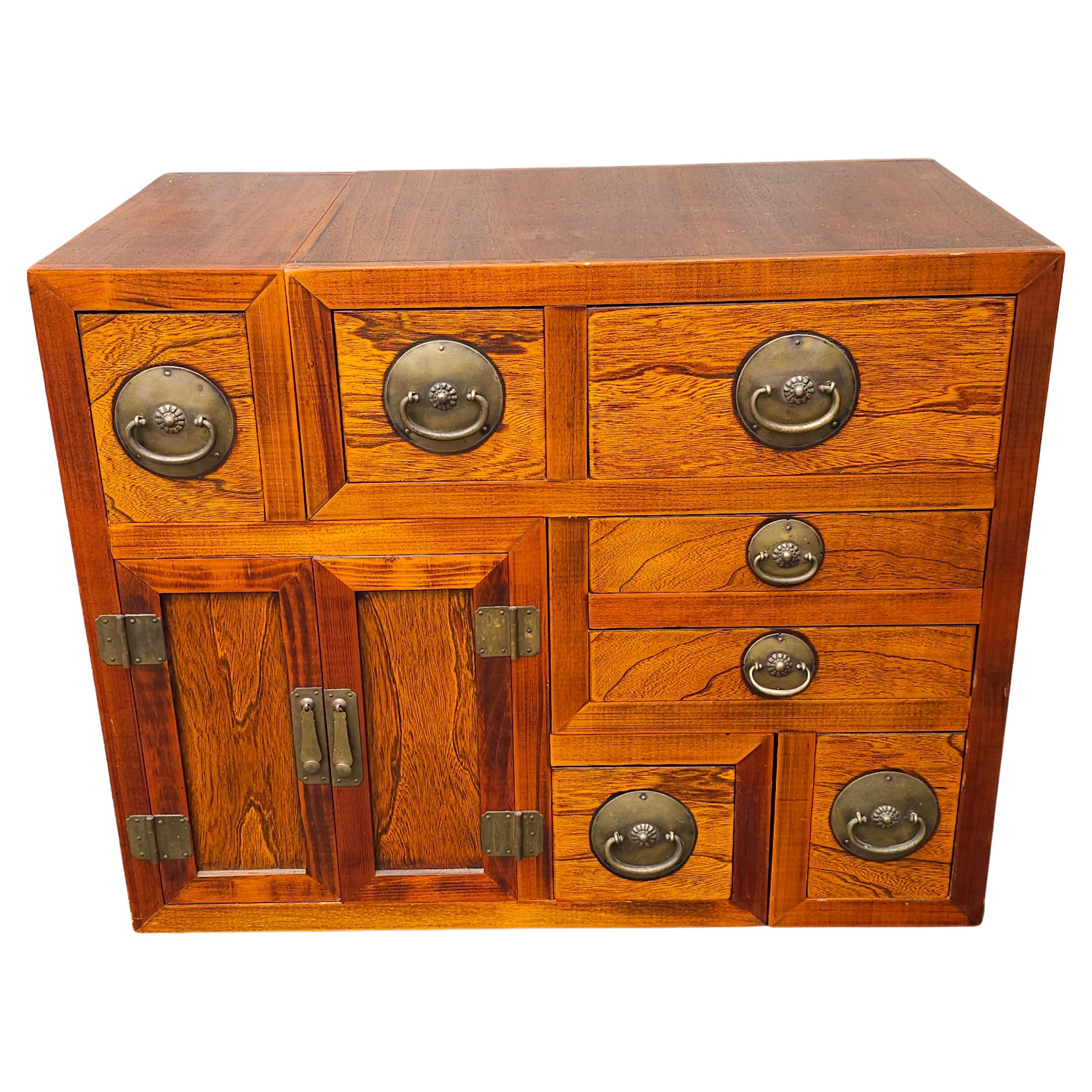 A South East Asian Tansu Double-Sided Two-Part Interlocking Cabinet. Measures 33