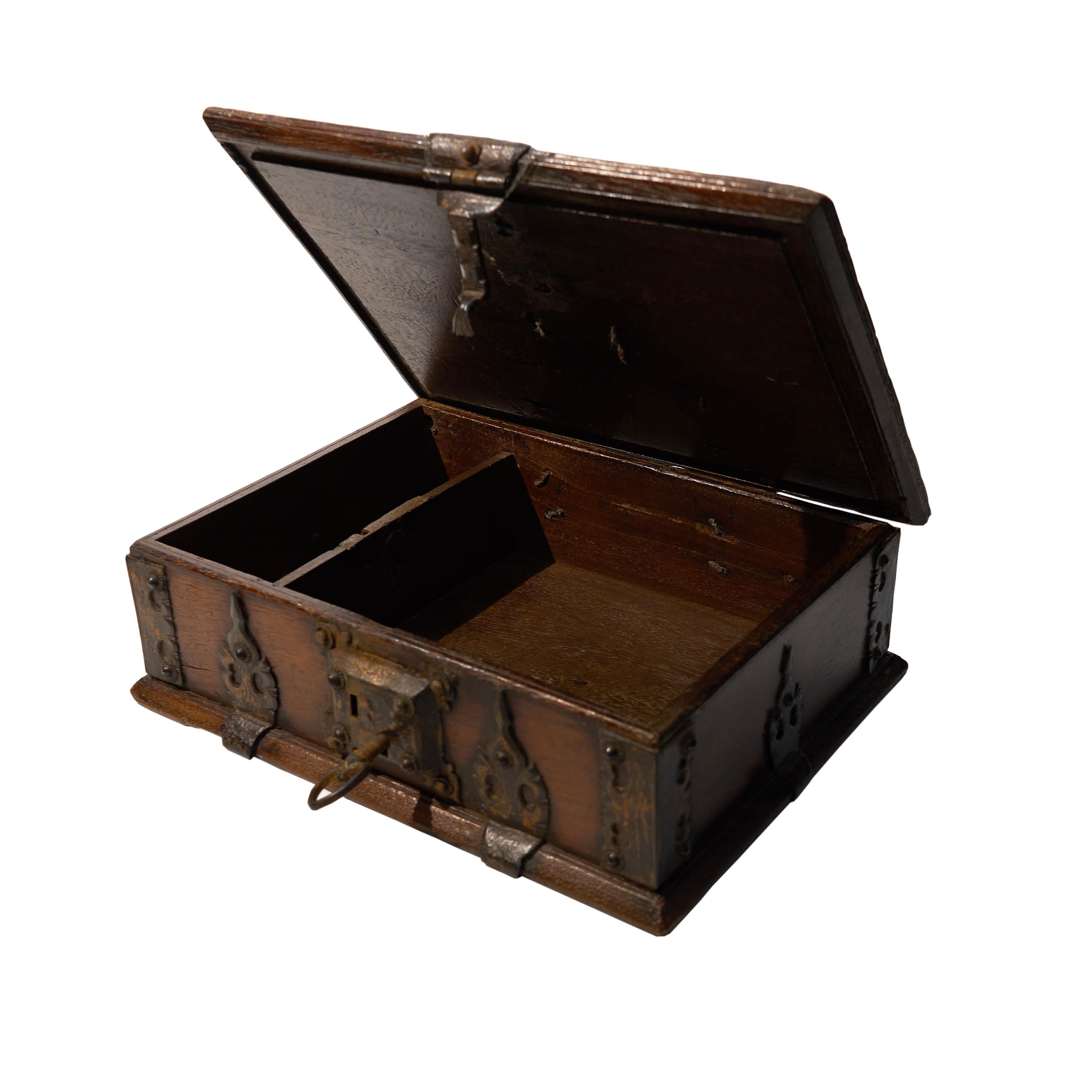 A rectangular casket with hinged lid and forged lock, carrying handles and iron forged reinforcing straps.
Date: end of 16th century.