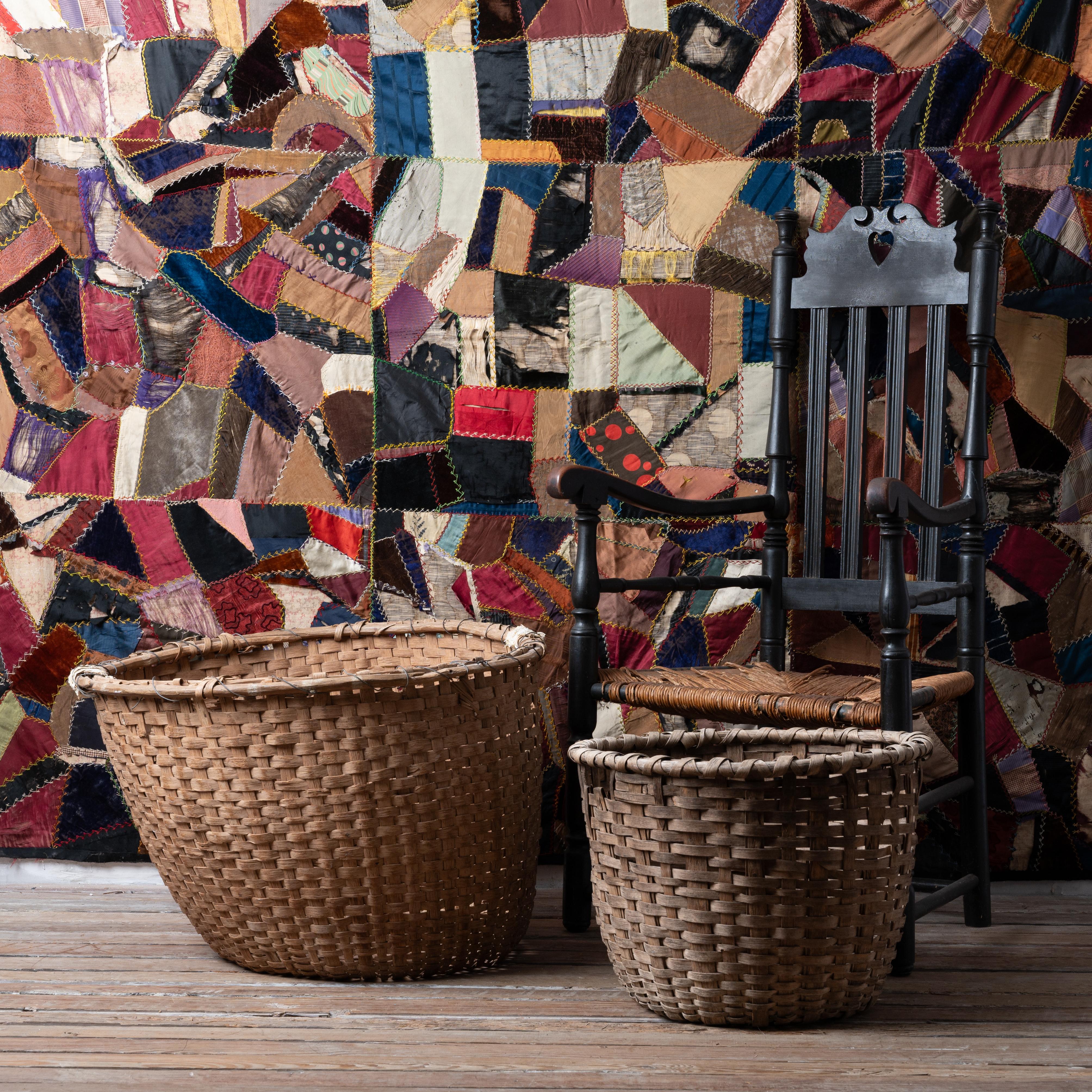 A pair of south Georgia plantation split oak cotton picking baskets, 19th century.

largest: 28 ½ inches wide by 27 inches deep by 19 inches tall
smaller: 20 inches wide by 20 inches deep by 14 ½ inches tall

