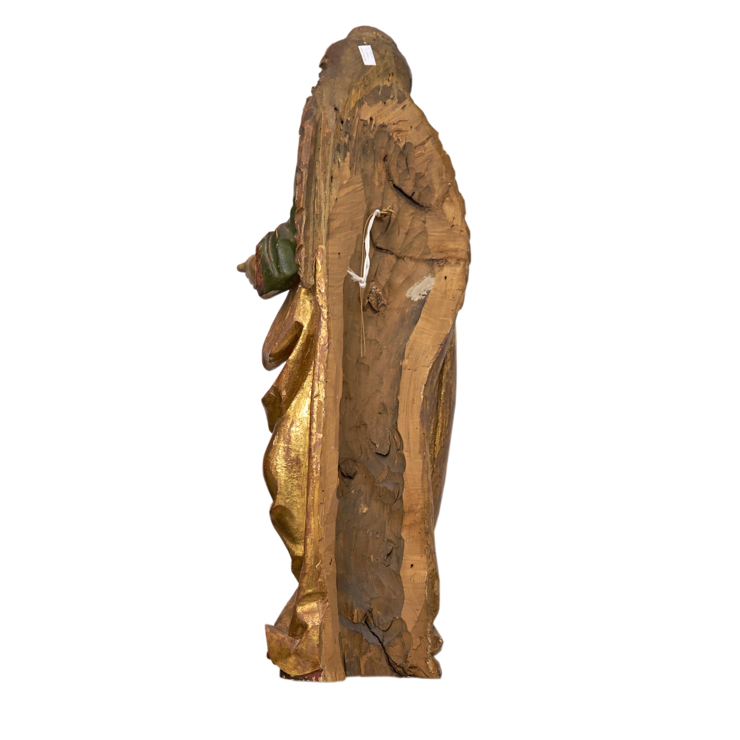A Gothic polychrome and gilt limewood sculpture of a Saint with a book
(probably St.Anna ), circa 1500.
The Saint depicted standing in contrapost, with curly hair running over her shoulders, with very fine hands, wearing an elaborately draped