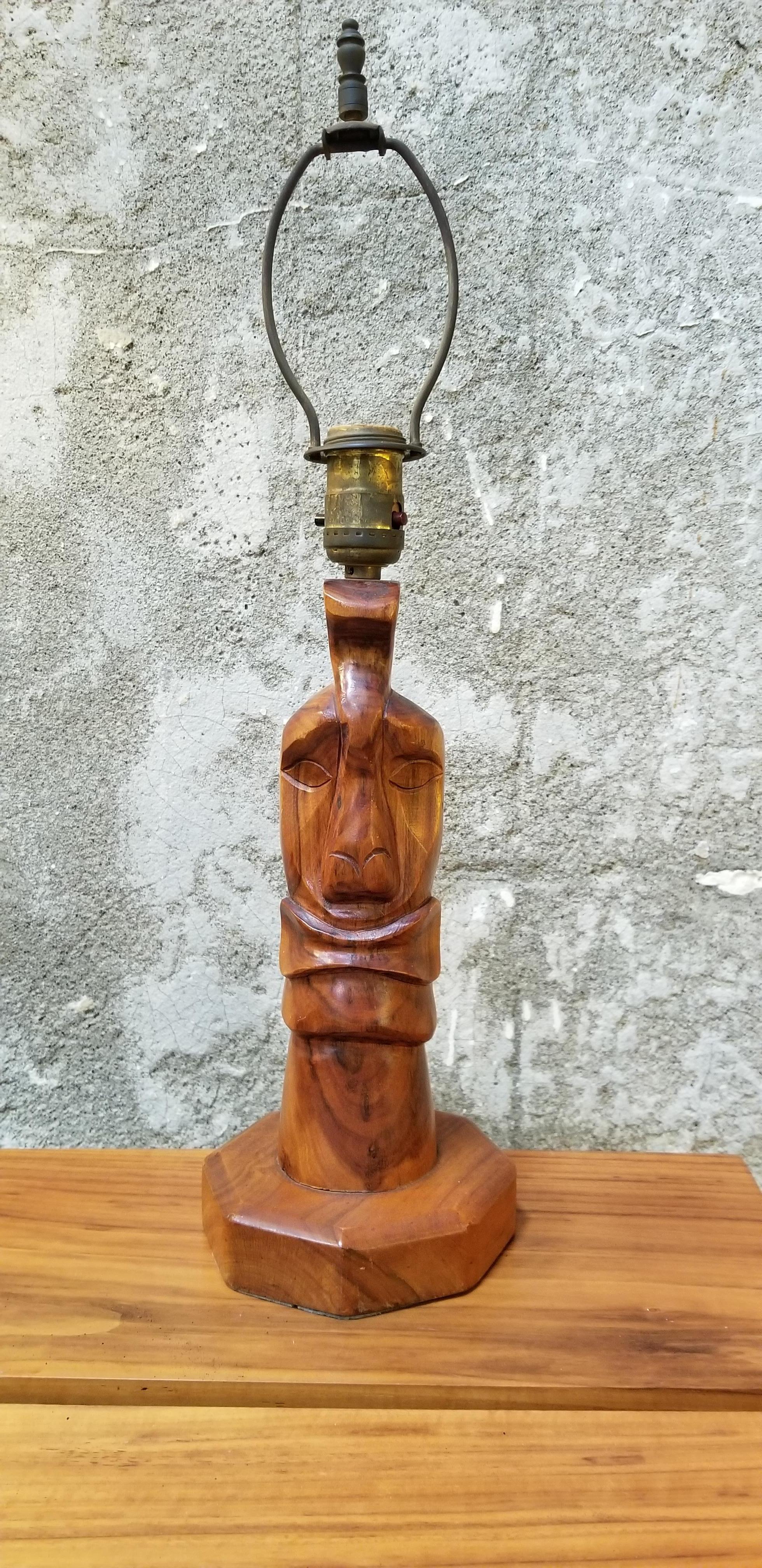 Exotic hand carved wood table lamp made of Monkeypod wood. South Pacific origin attributed to Hawaii. Shade is new, circa 1950s-1960s. New shade.