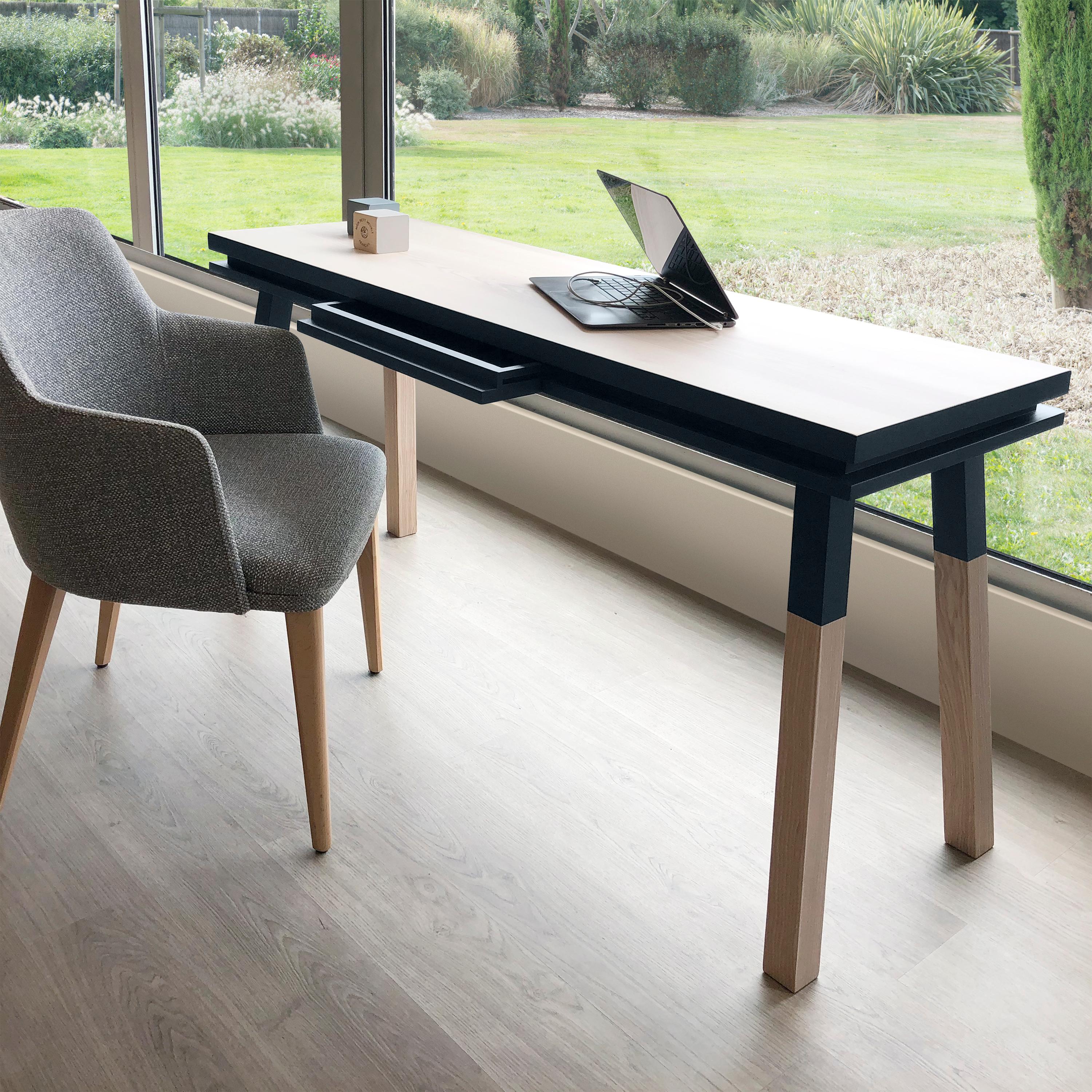 This dark blue rectangular console desk/table is designed by Eric Gizard in Paris. Eric is well know for its beautiful sleek design adapted for French craft brands and luxury groups. This desk is part of the ÉGÉE collection enhancing the refined