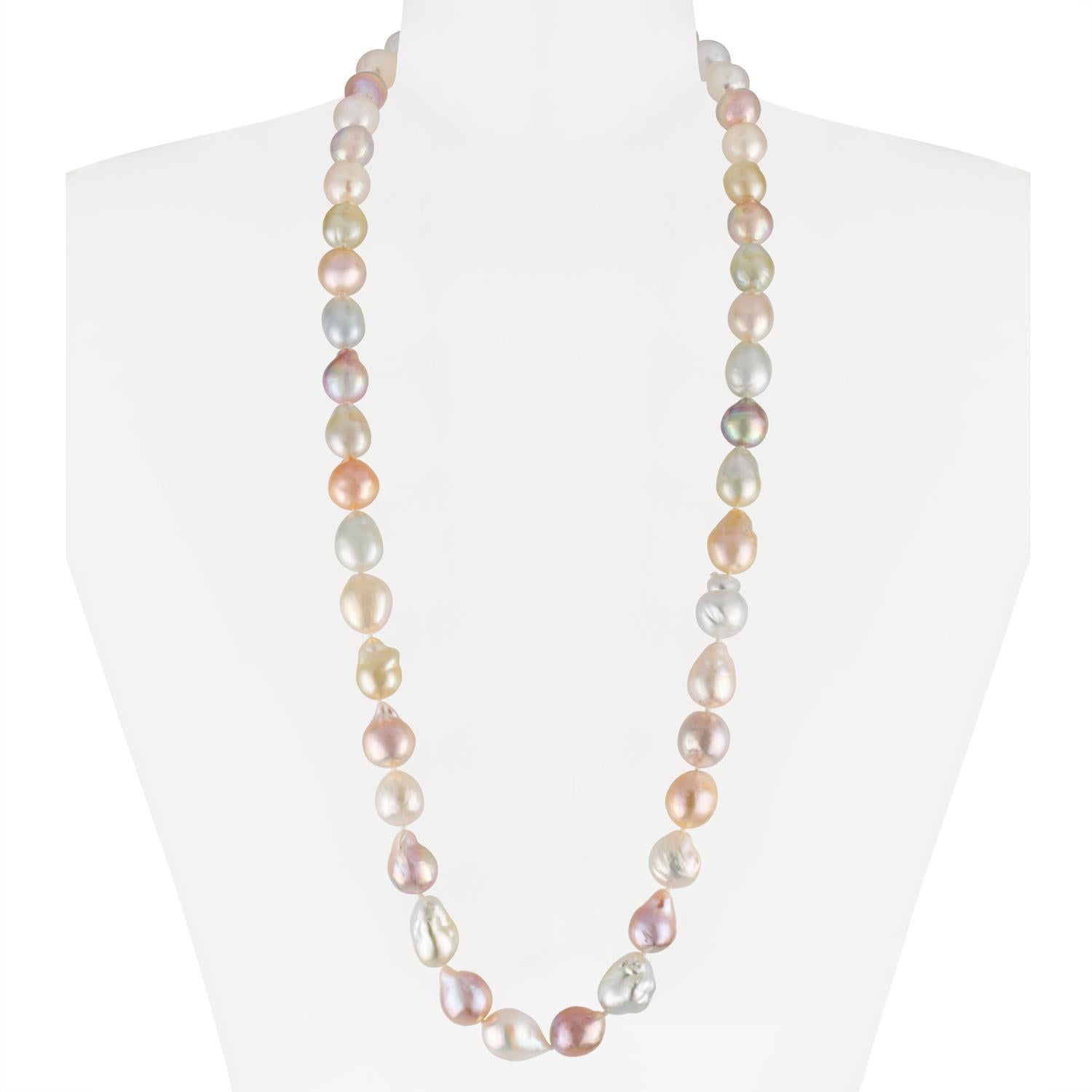This rope length necklace blends South Sea white, South Sea golden, and multiple hues of Chinese freshwater natural-color baroque cultured pearls. The double length rope necklace features pearls measuring 13x15.5mm and is 36 inches in length. This