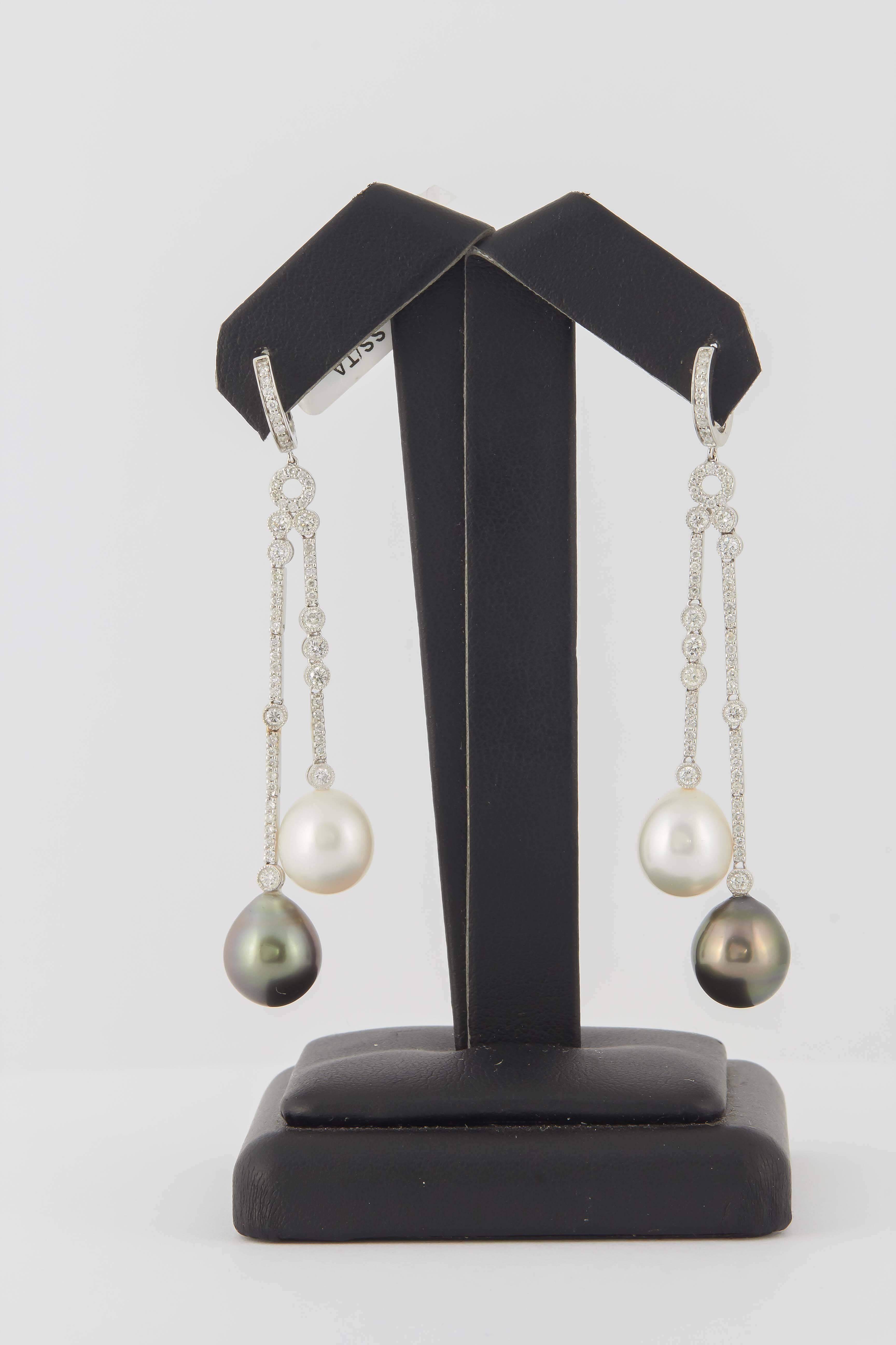 18KW 
5.6 g.
South Sea and Tahitian pearl 10-11 mm
114 Diamonds
1.07 Cts.
