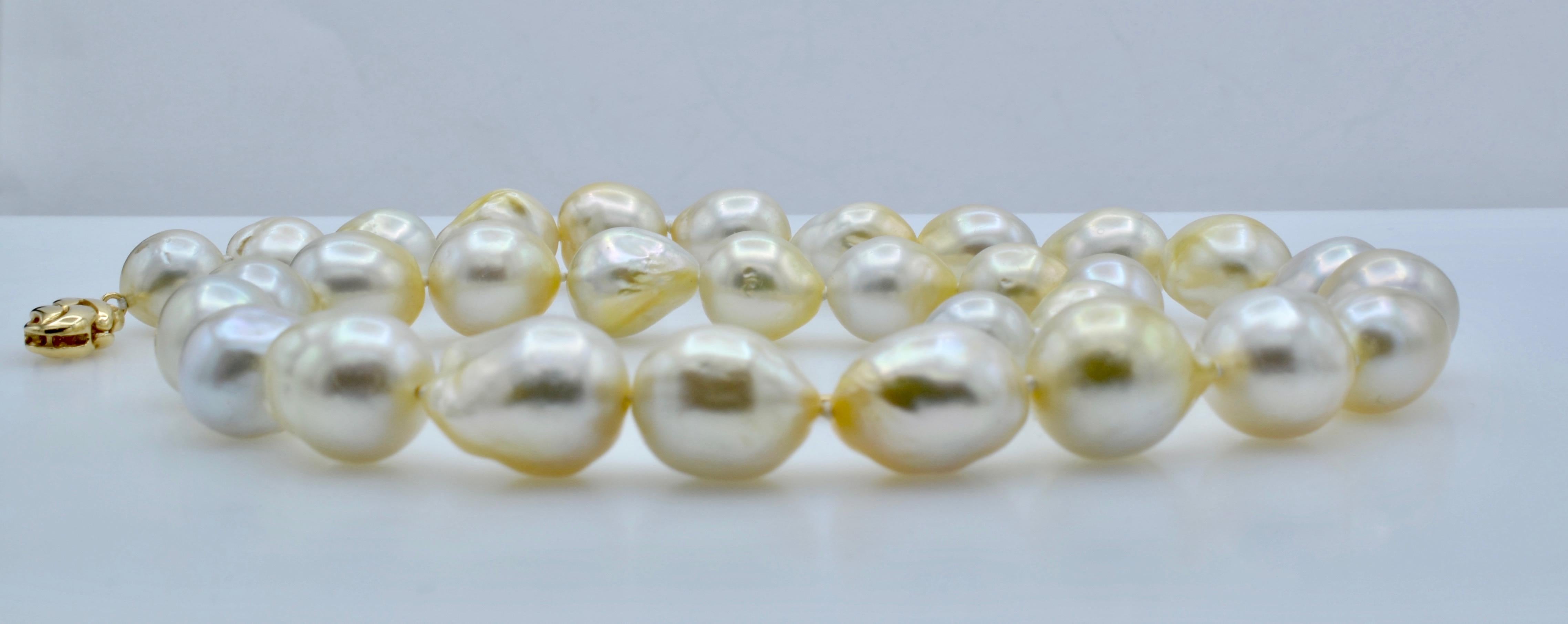 Beautiful South Sea white with a golden cast pearl necklace with a 14k gold clasp. 31 pearls from 11.5 to 16 mm and with a nice heavy weight of 50.7 gr 
The length is 18.5. The yummy glow of these pearls is mesmerizing!