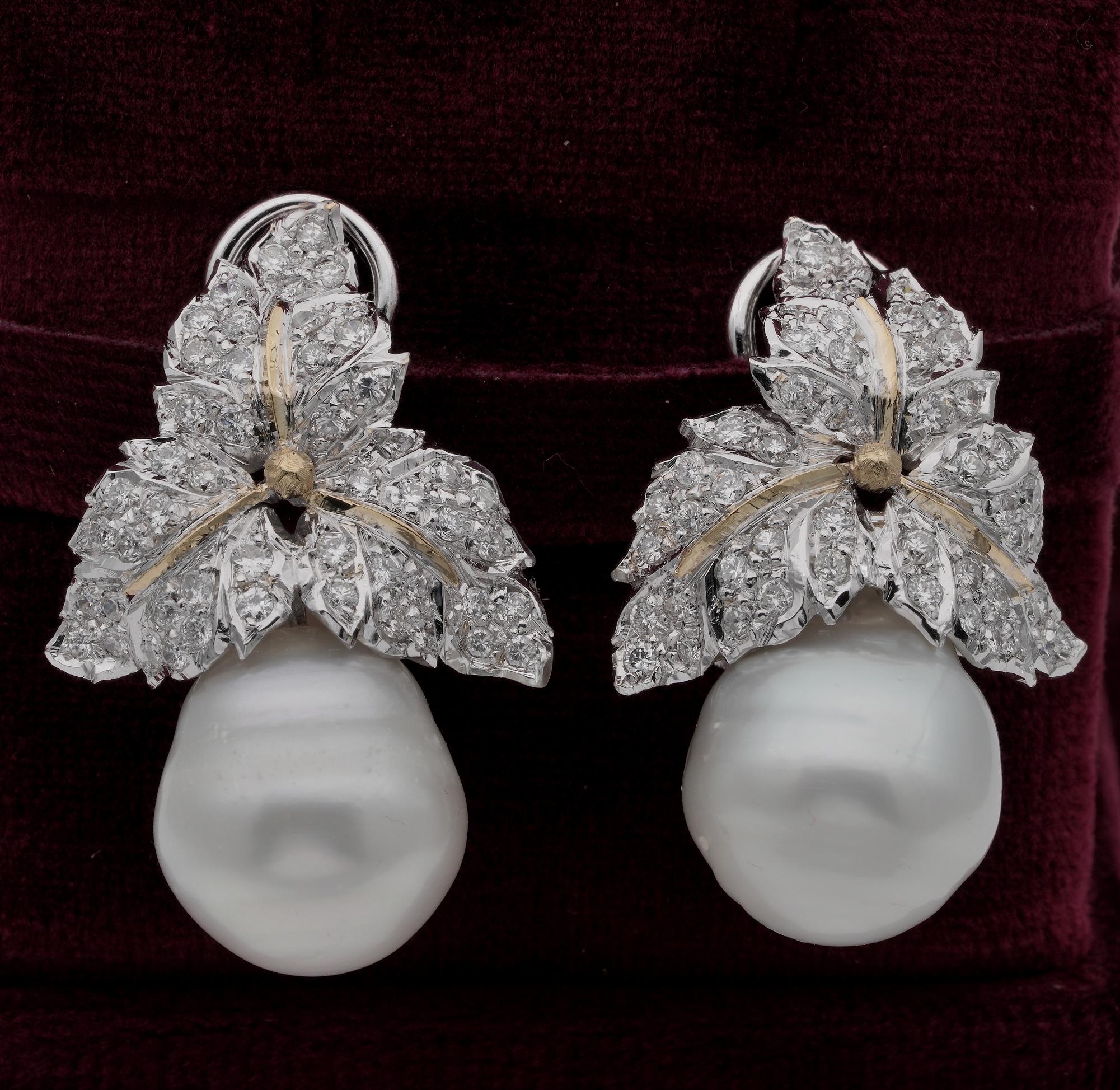 These outstanding vintage pair of earrings date 1960 ca
Superbly hand modelled as unique by some past master in a group of fantastic leaves toppingtwo large South Sea Pearls,  solid 18 KT white gold
The two large South Sea Pearls are 14 mm. x 13.5